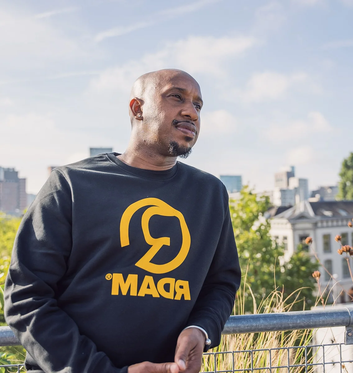 Randy Telg, founder of We Run Thiss, photographed outdoors in Rotterdam