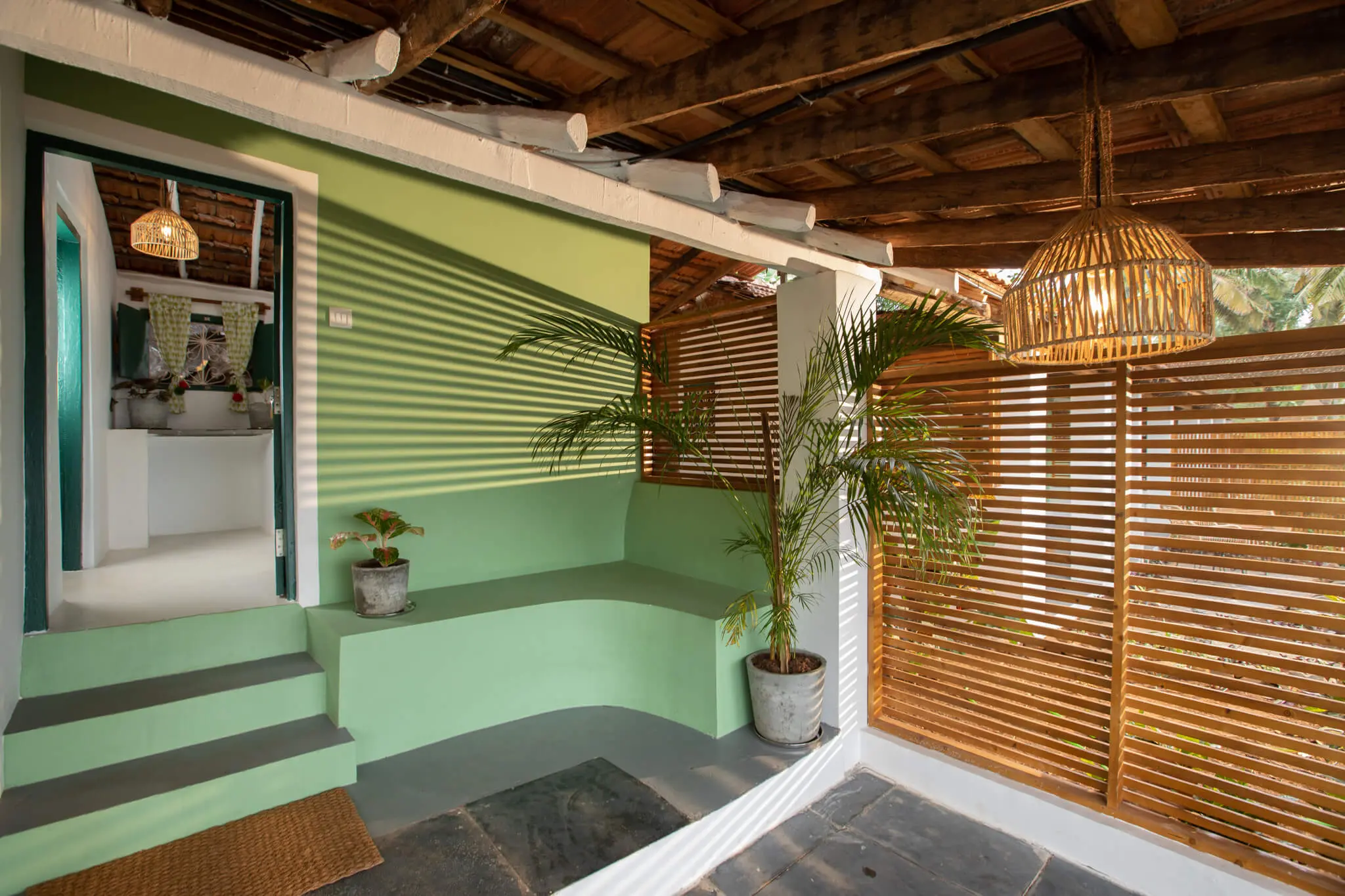 Sea View Room 4 at Casa Jaali — sea-green veranda with slatted screens