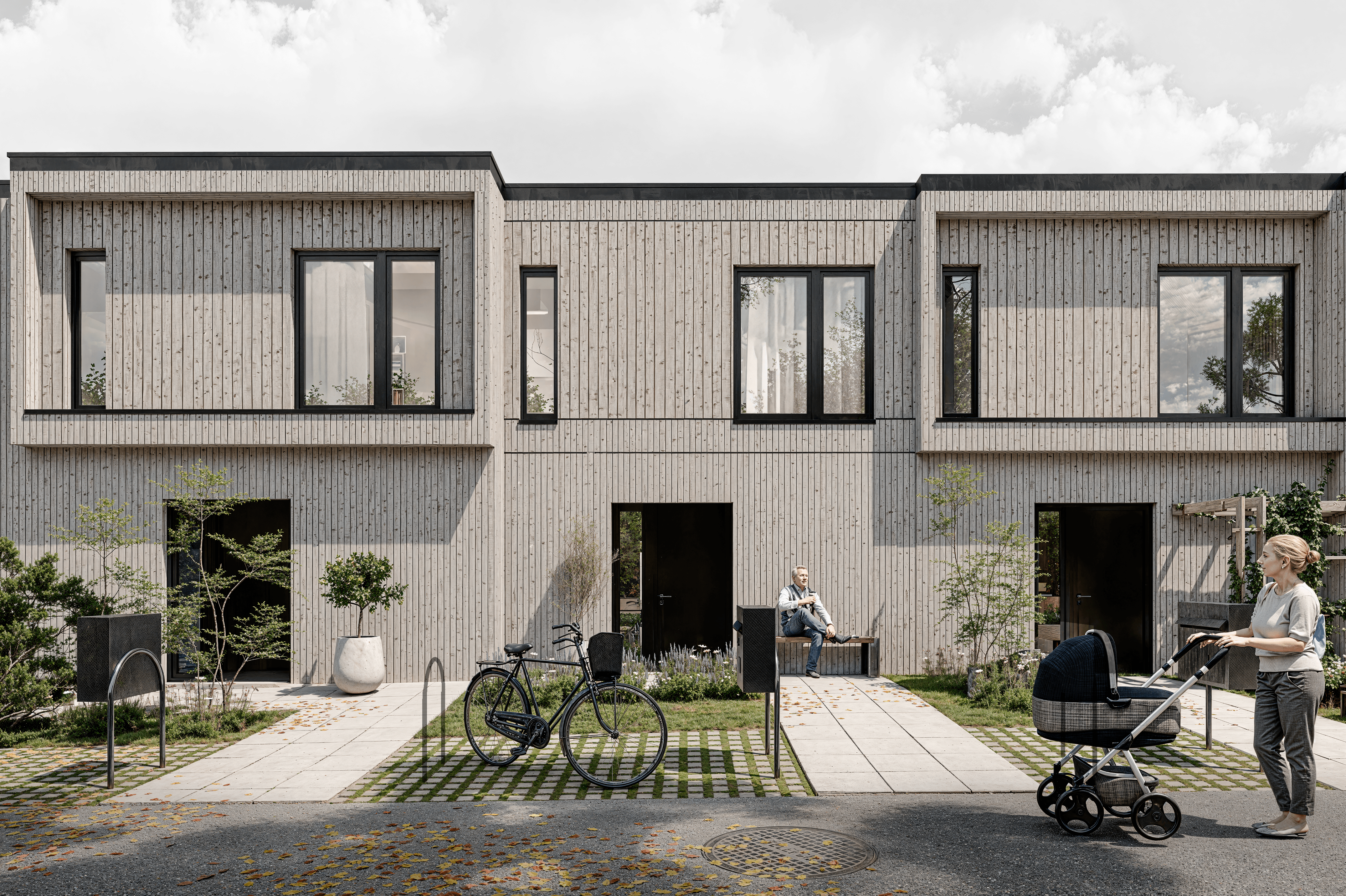 Modern glass building with illuminated trees and a view of city skyscrapers