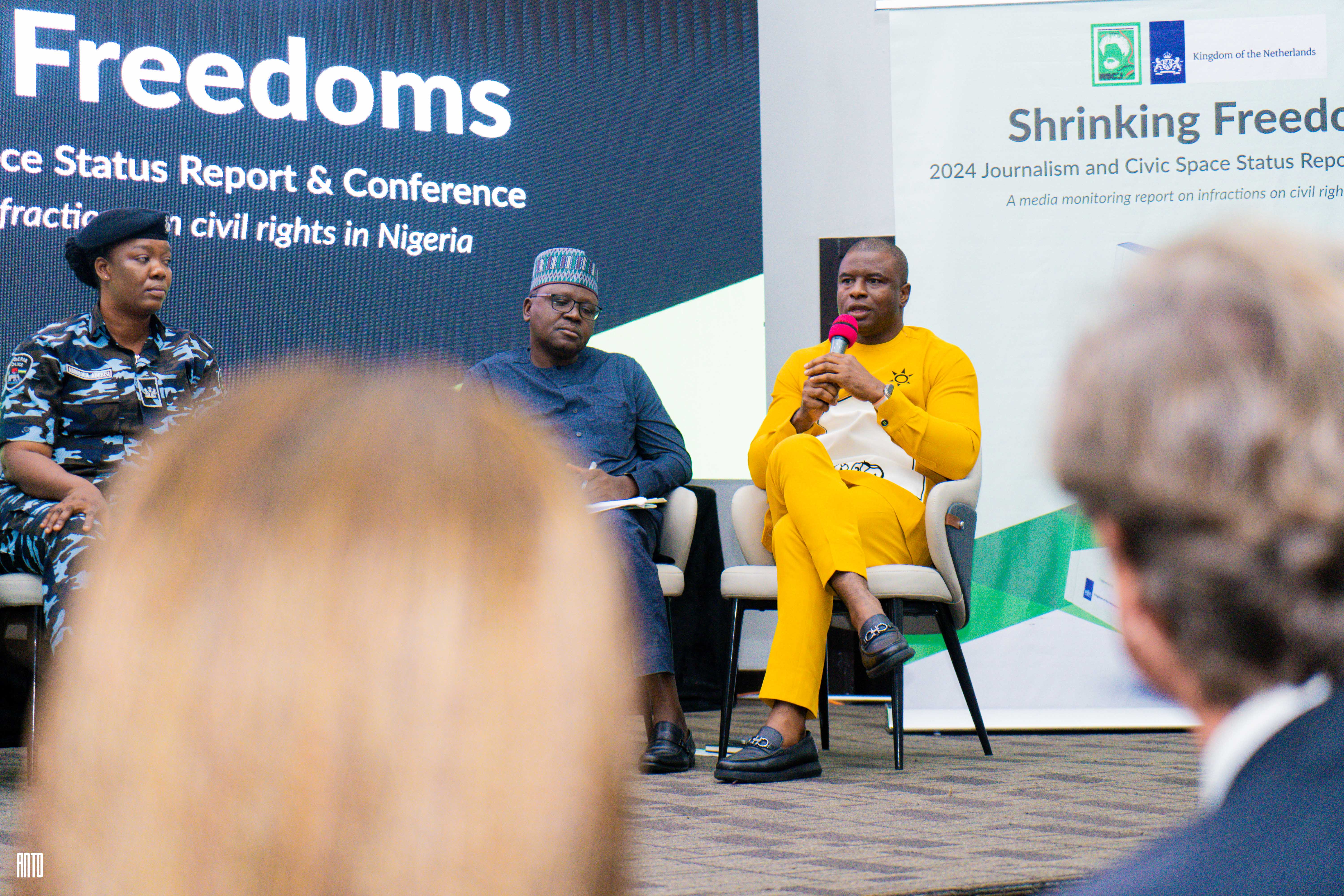 unpaired green leather shoe on top of white box