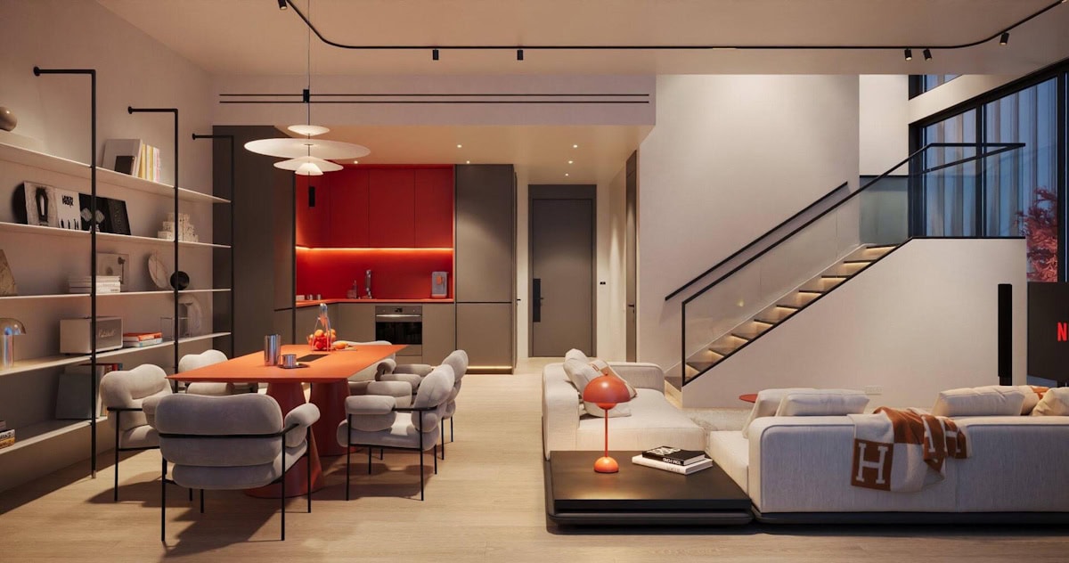 Stylish living room with white furniture complemented by red accents, reflecting the Villa del Arte aesthetic.