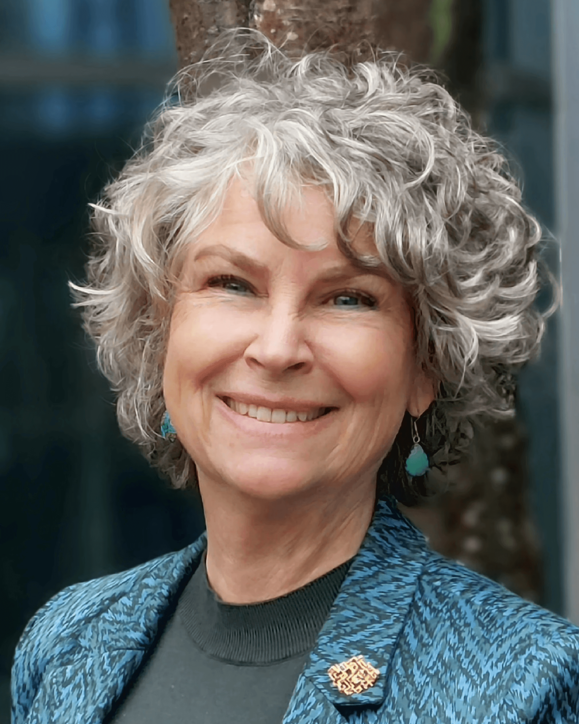 A women with a black shirt, and a dark background