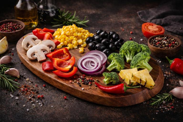 pizza with green leaf vegetable