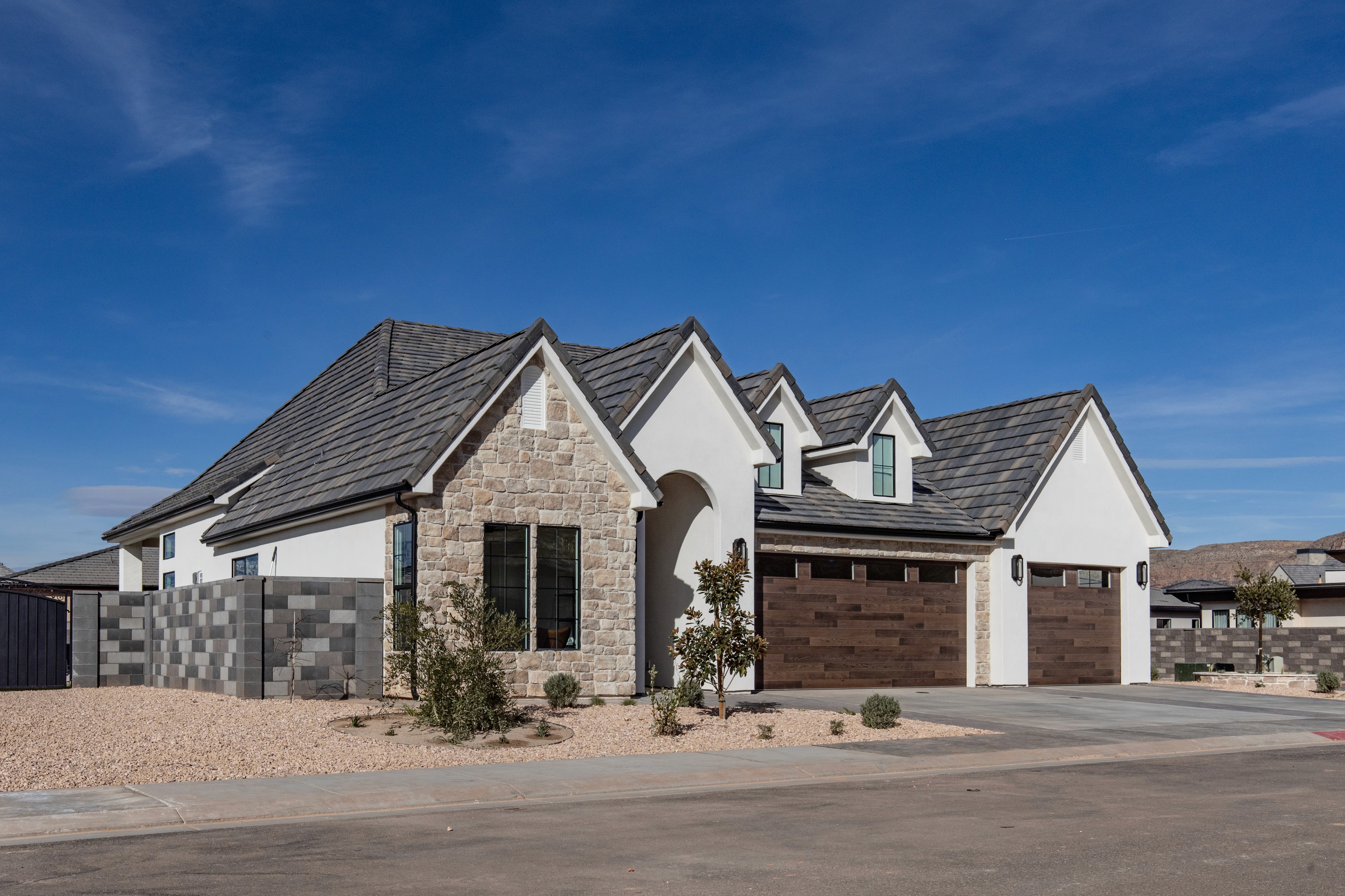 Front yard in Hurricane, Utah featuring xeriscaping with decorative rocks and drought-tolerant landscaping.