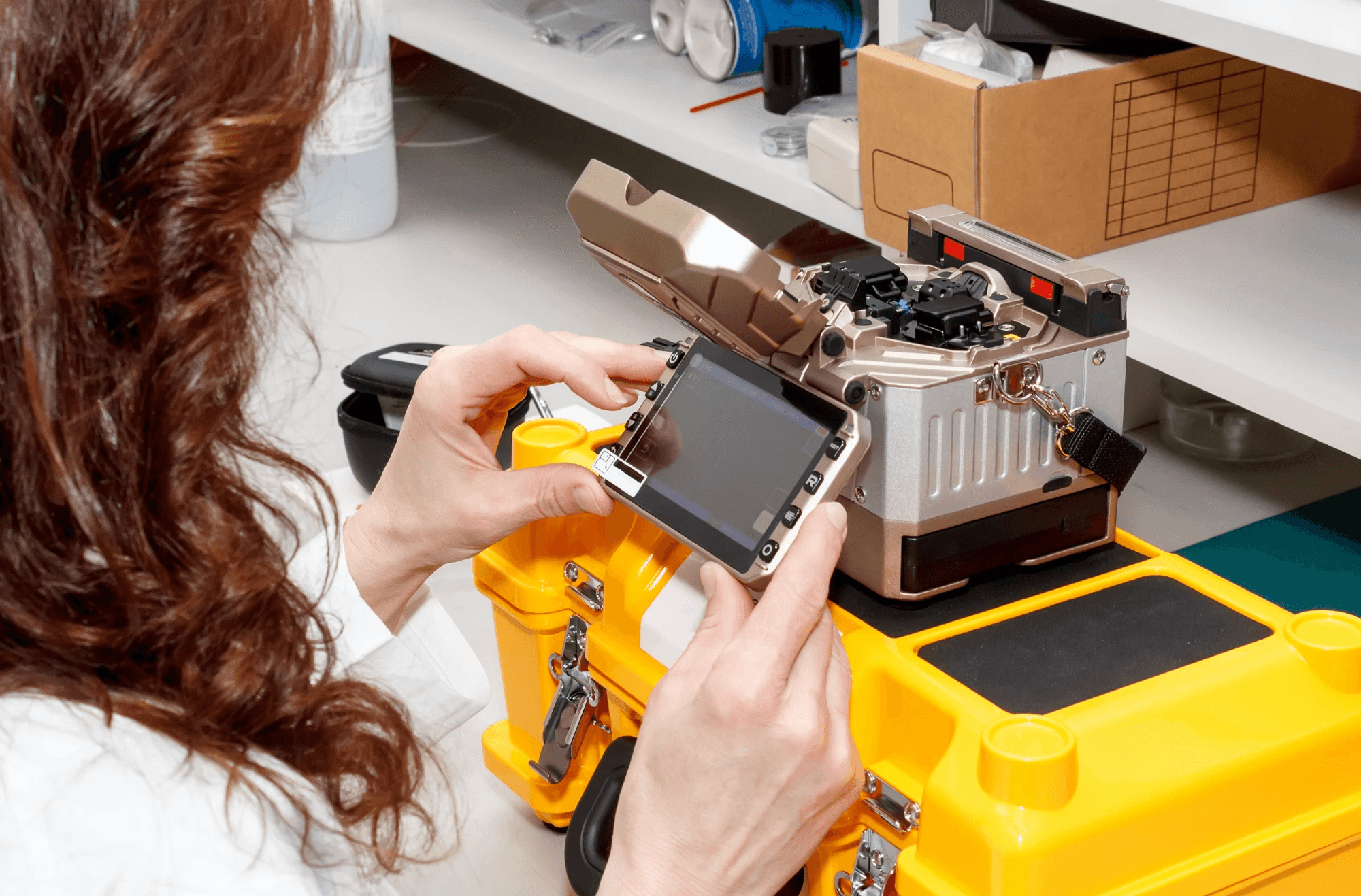 Student working hands-on with technical training equipment