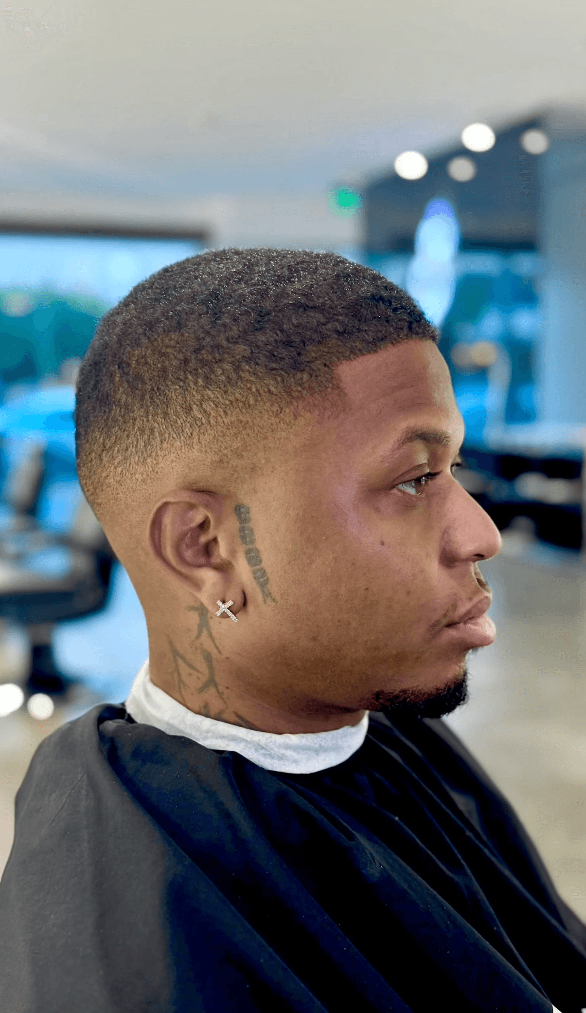 High fade with a smooth finish, ideal for young men seeking a sharp and edgy haircut