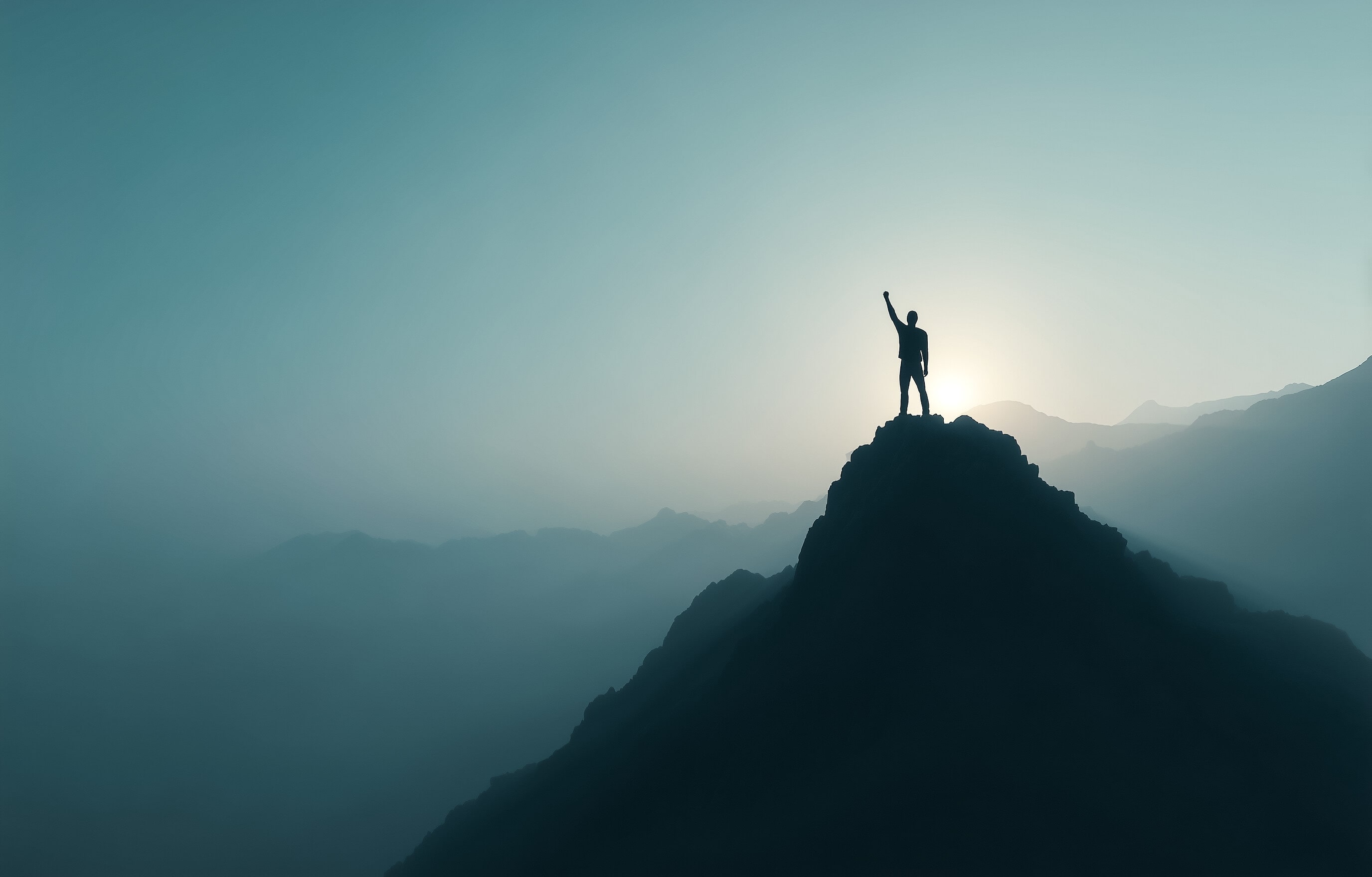 man on top of mountain