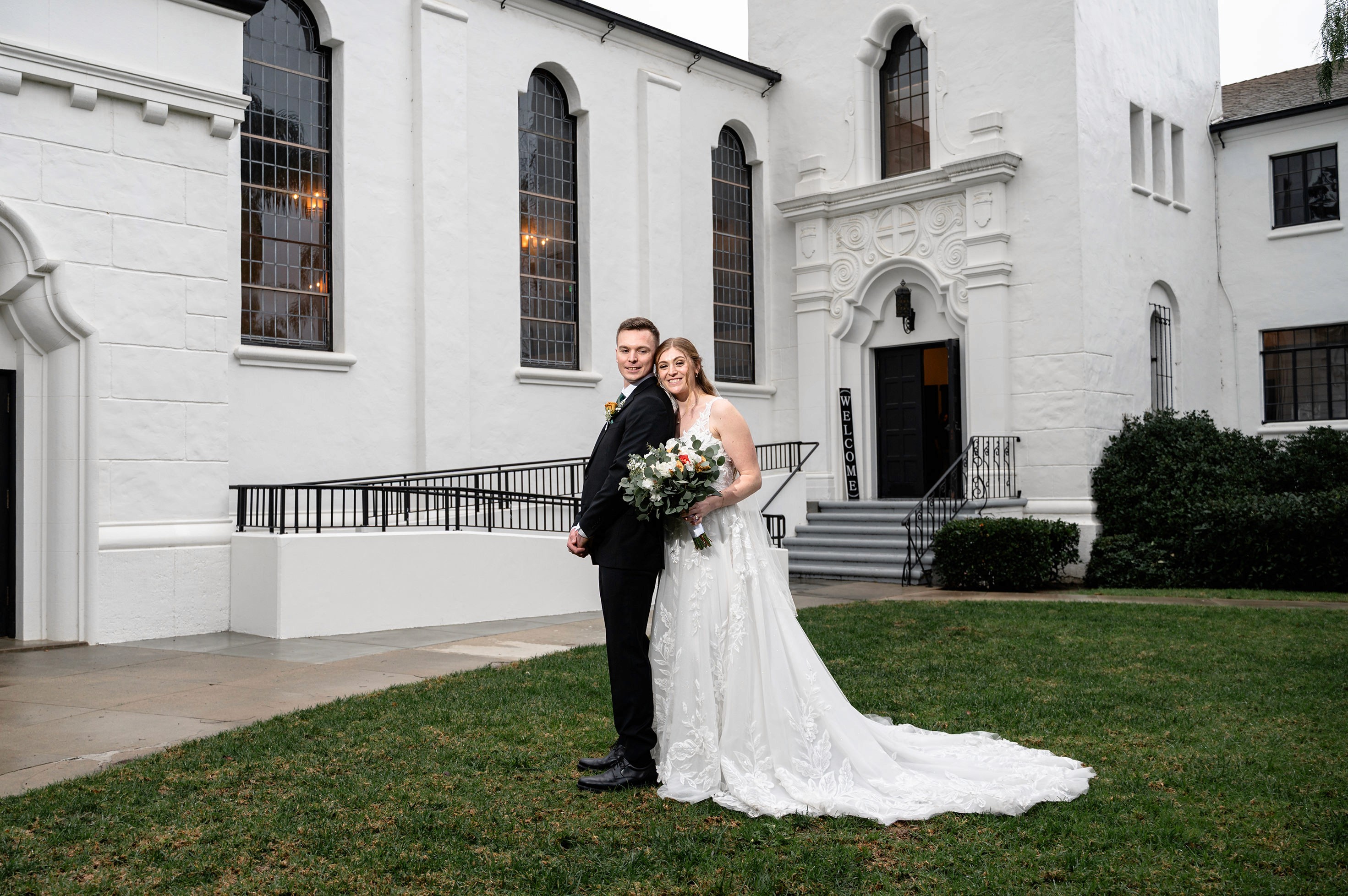Flat lay wedding details with bouquet, rings, and sparkling bridal heels