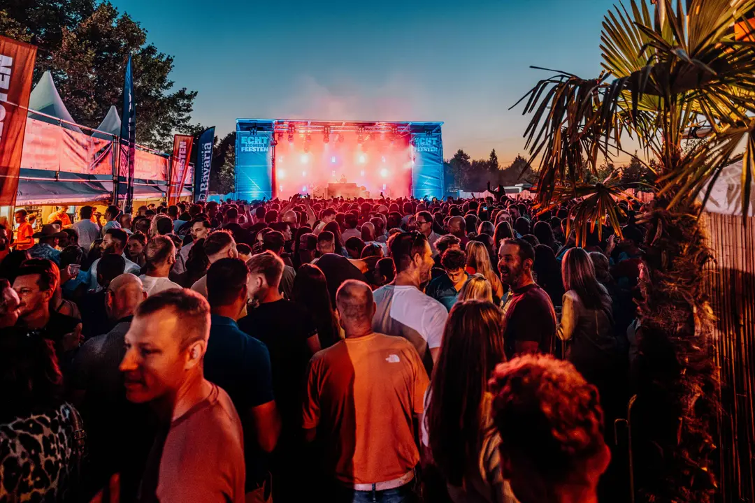 Festival stage with lights and crowd