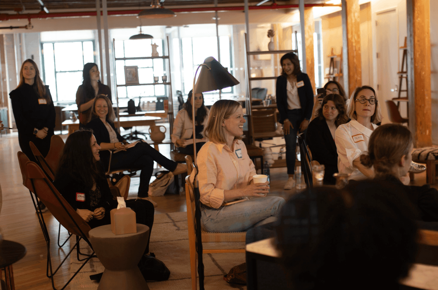 Group of people listening to a speaker
