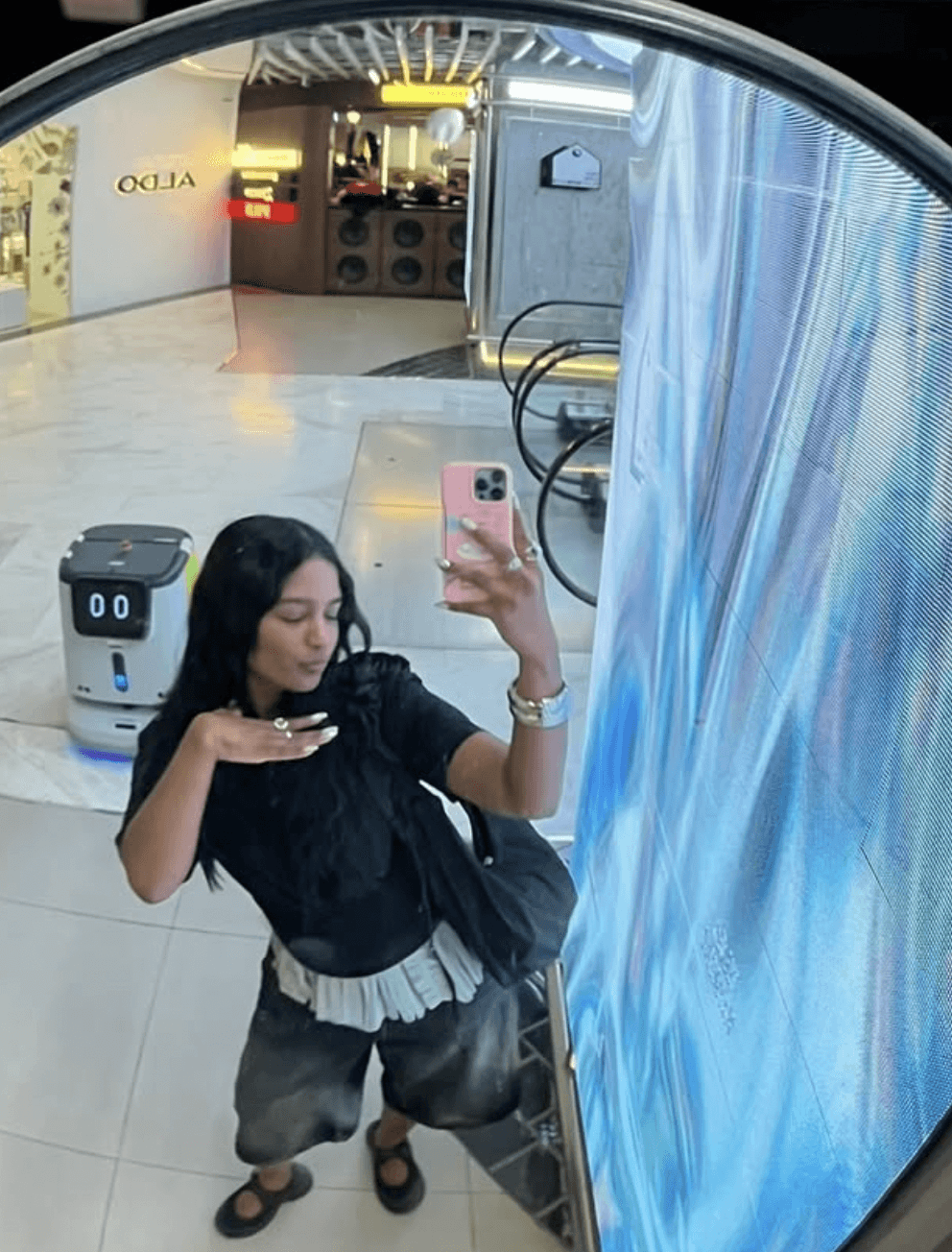 a japanese style building with a japanese roof and trees around it