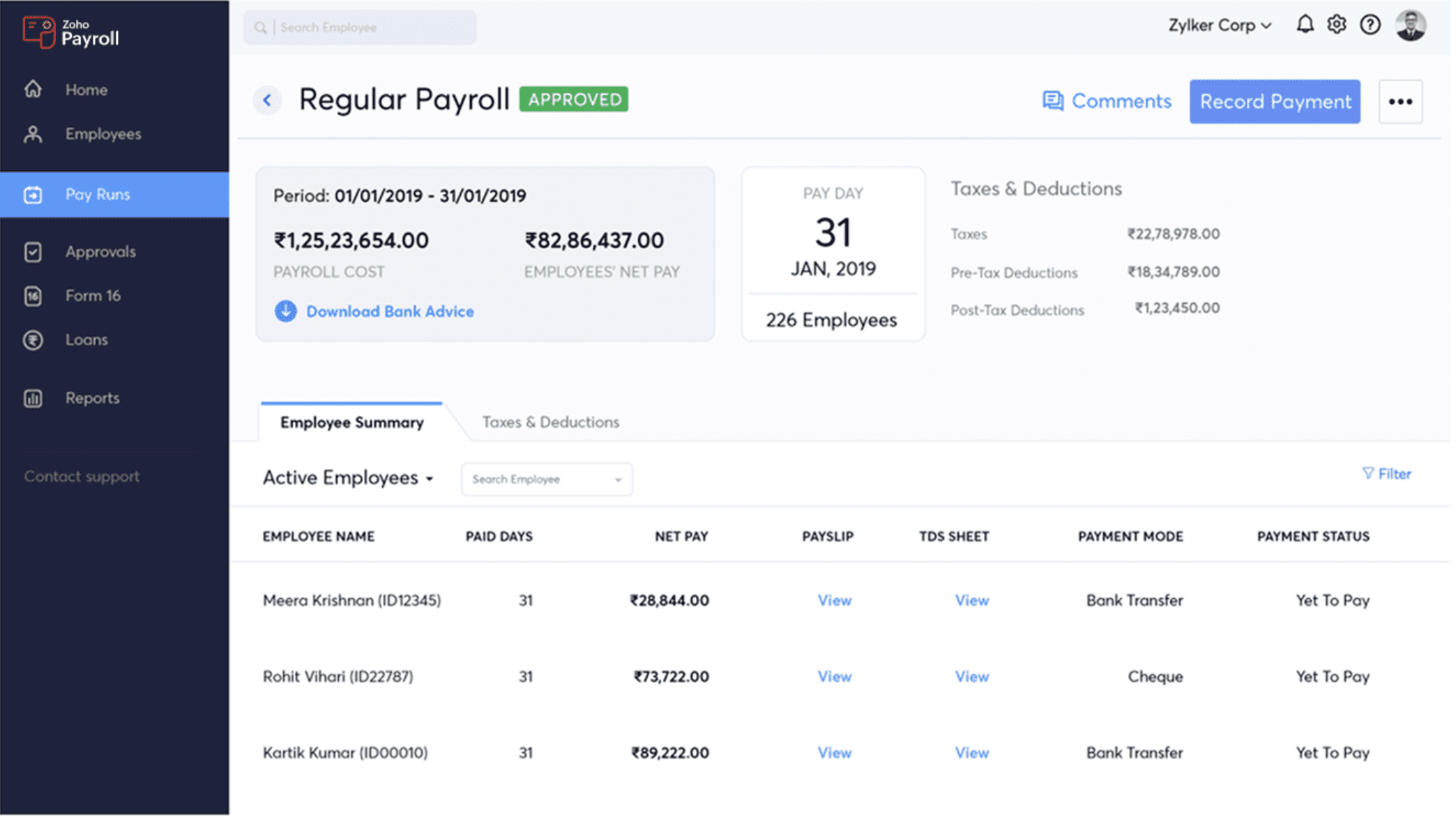 Two colleagues smiling and giving a high-five at a desk in a modern office with a laptop, coffee mug, and plants.