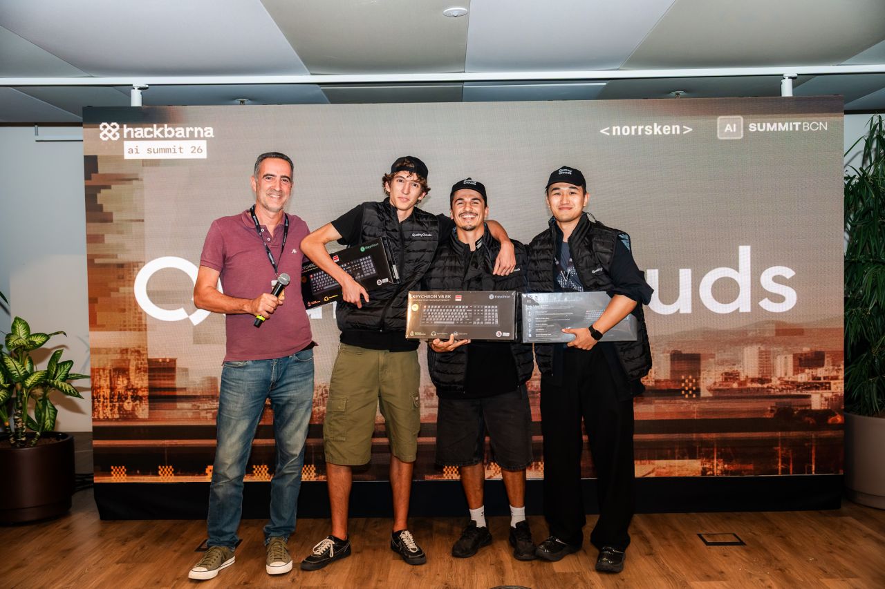 Albert Franquesa with the Bye-Bye Scammer team holding their keyboard prizes at HackBarna