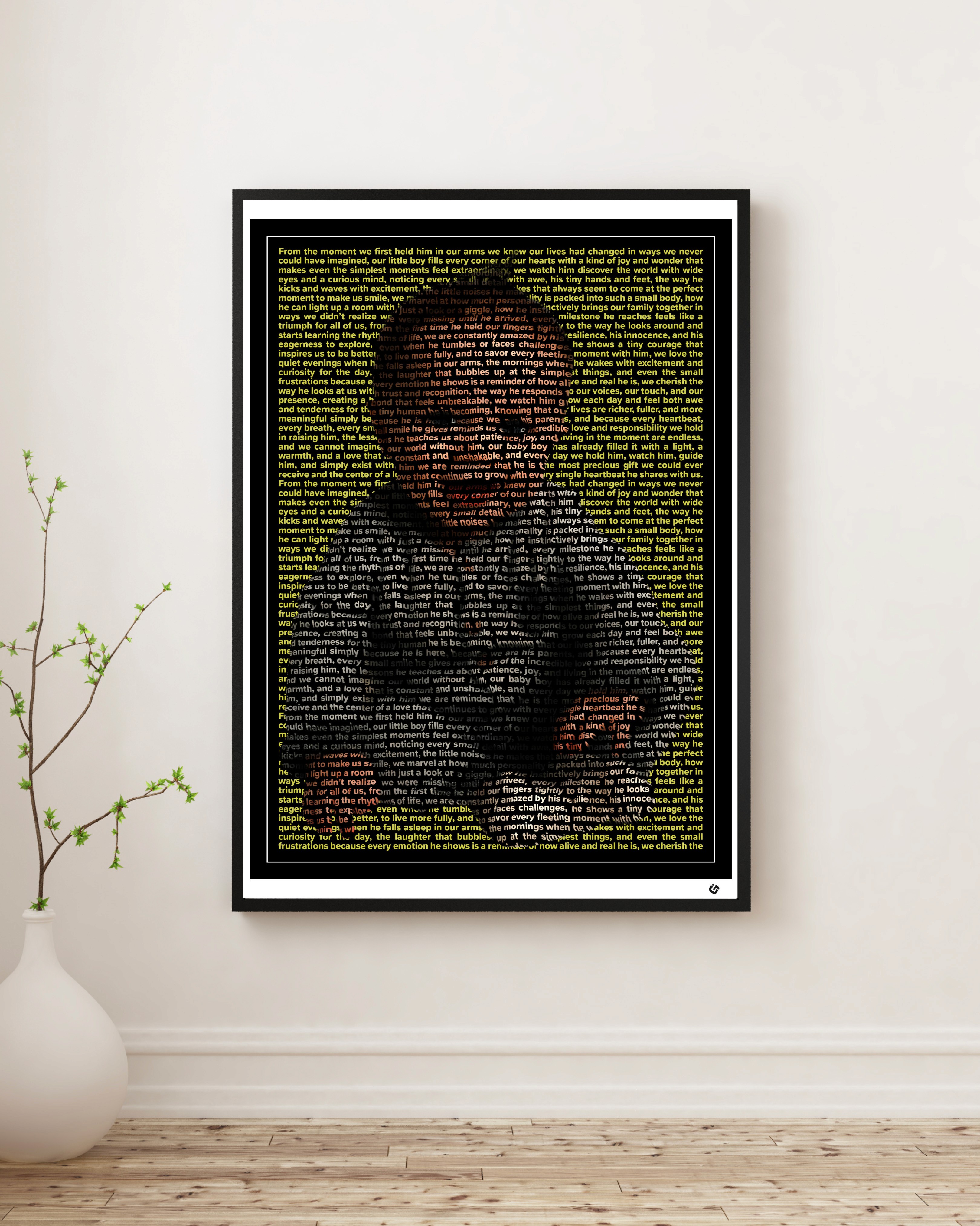 Custom text portrait artwork of a baby boy, created entirely from layered colored words that form his face, hair, and clothing. The piece is displayed inside a modern frame with a thin white line, a black border, and a white mat.