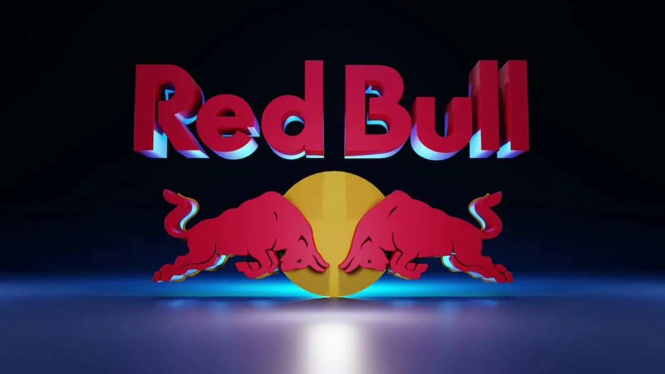 Das Red Bull-Logo, mit zwei roten Stieren, die sich vor einem goldenen Kreis gegenüberstehen, symbolisiert die Energie und das Engagement hinter der Jugendfußballentwicklungskampagne von RB Leipzig, die darauf abzielt, junge Talente zu unterstützen und die Fußballgemeinschaft in der Region Leipzig zu stärken.