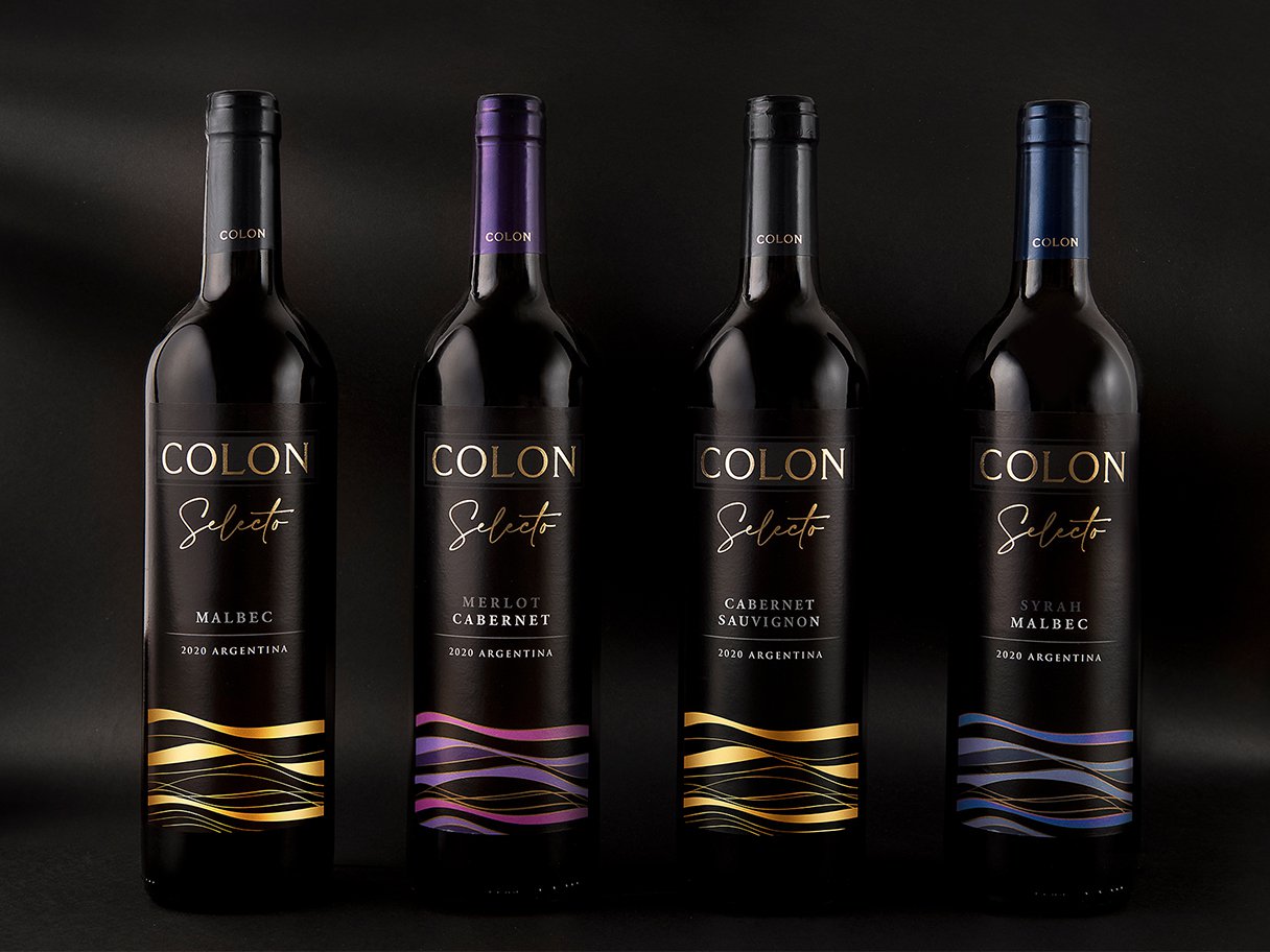 Rustic cabin in a golden field at sunset