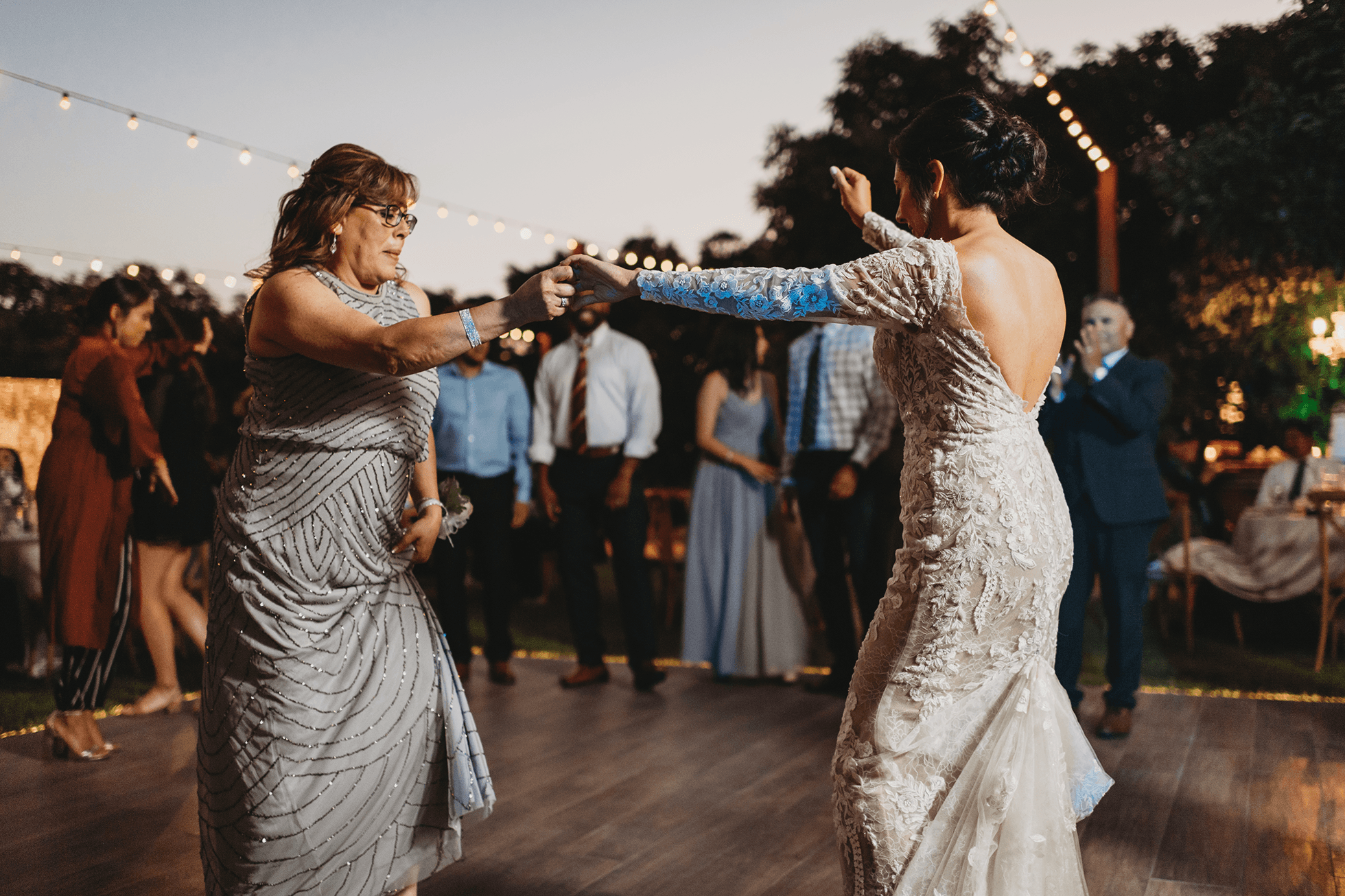 Flat lay wedding details with bouquet, rings, and sparkling bridal heels