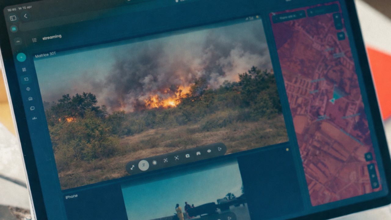 AirHub drone operations screen showing a live wildfire video feed beside a map layer for situational awareness