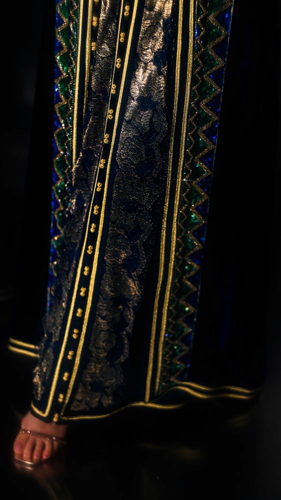 Deepsea Blue Moroccan caftan with gold and green embroidery, handcrafted couture design inspired by traditional Moroccan artistry