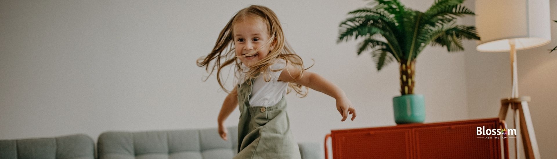 a kids happily jumping