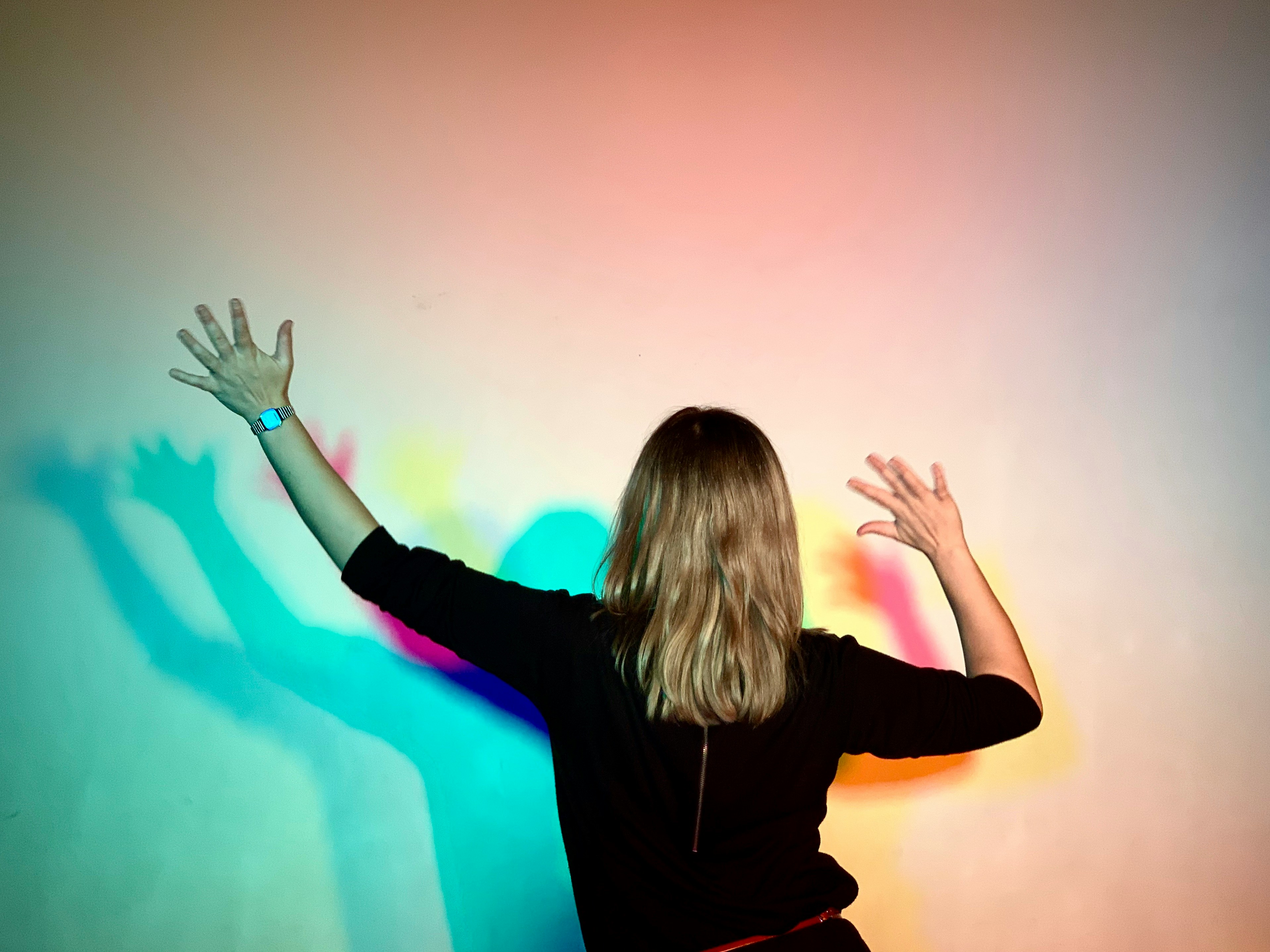 woman standing beside a wall - Getting Your Colors Done