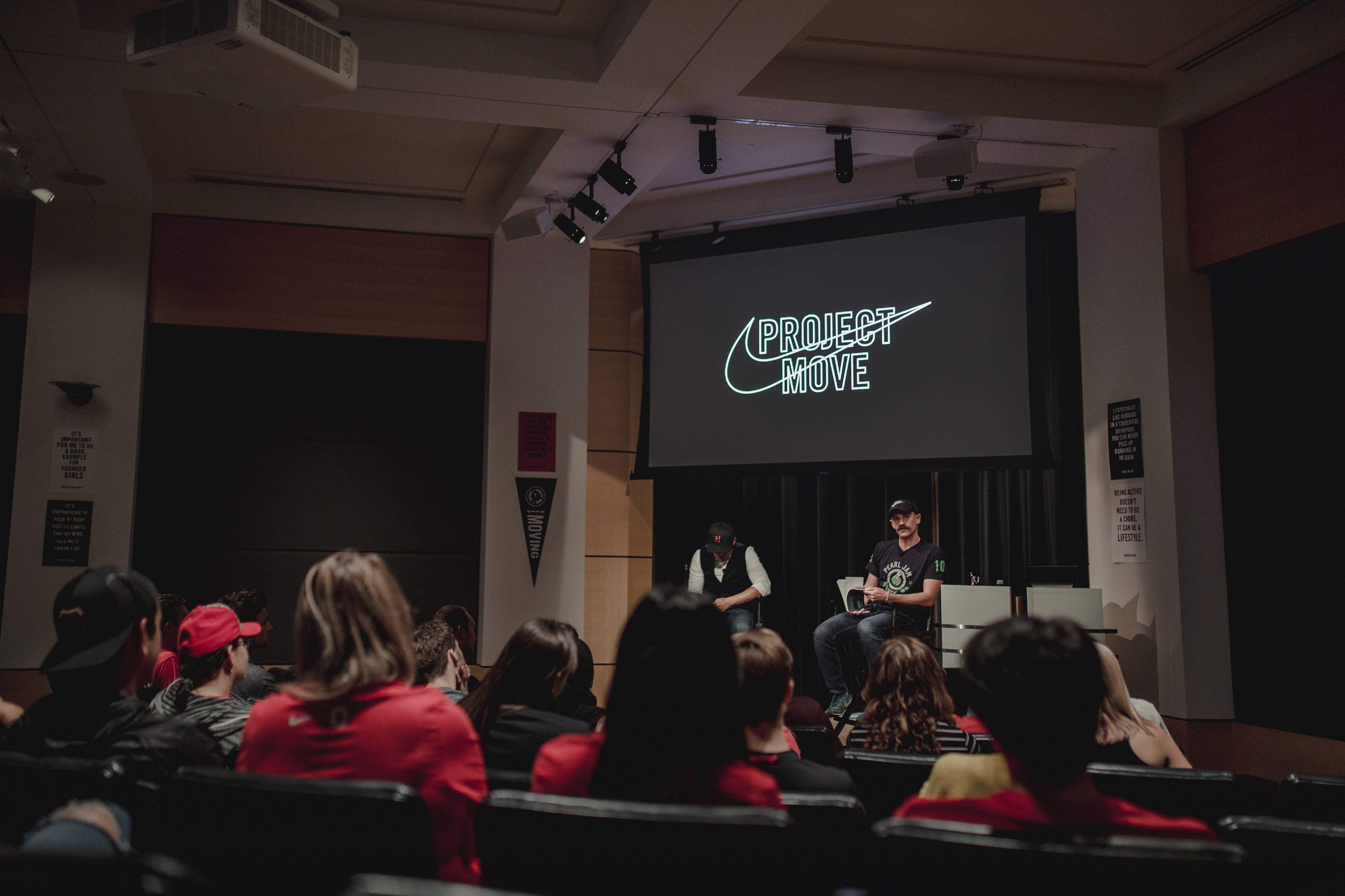 Kevin Carroll and Coach Bennett presenting in front of the students