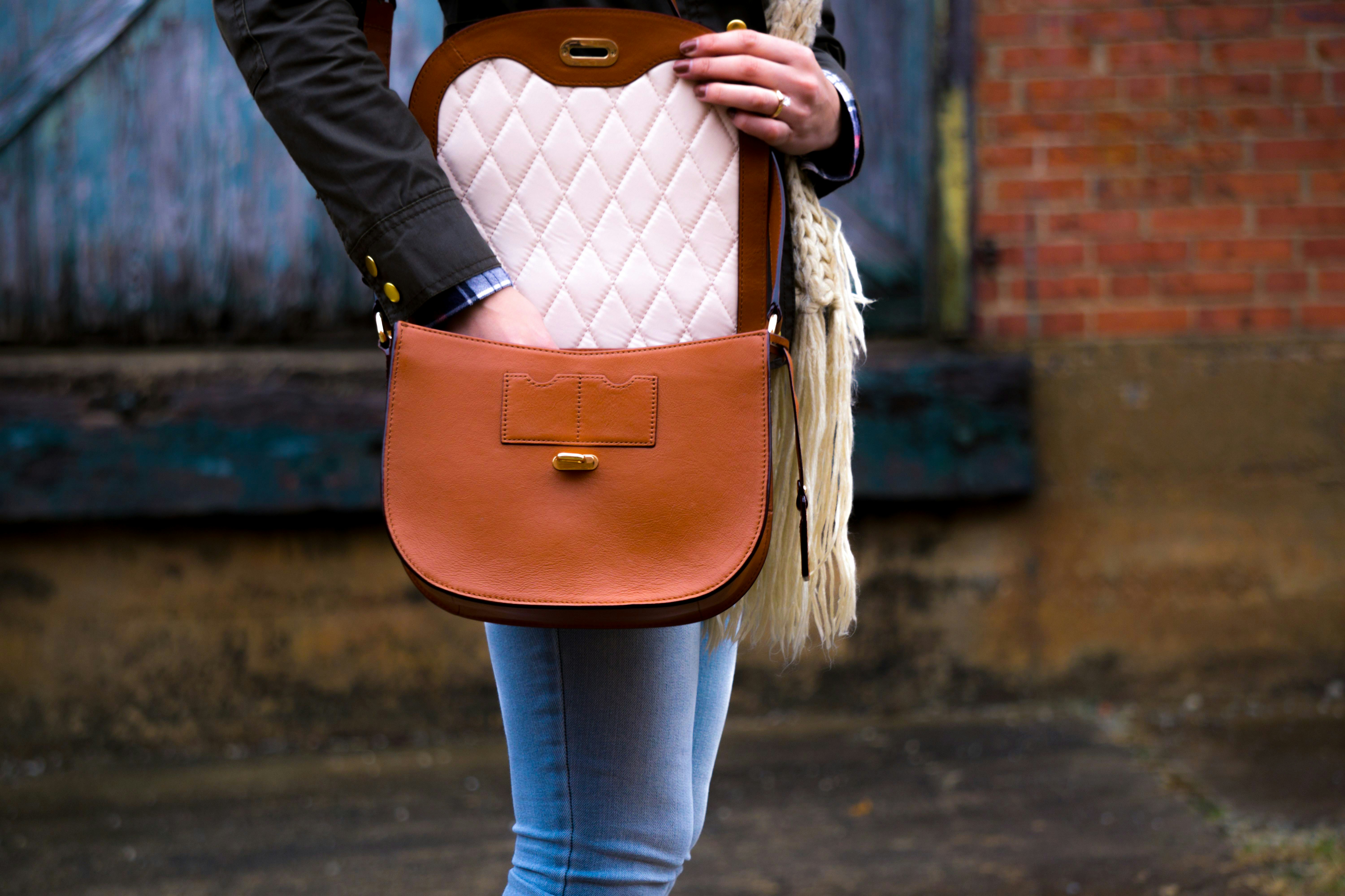 woman holding a bag - Cozy Fall Outfits