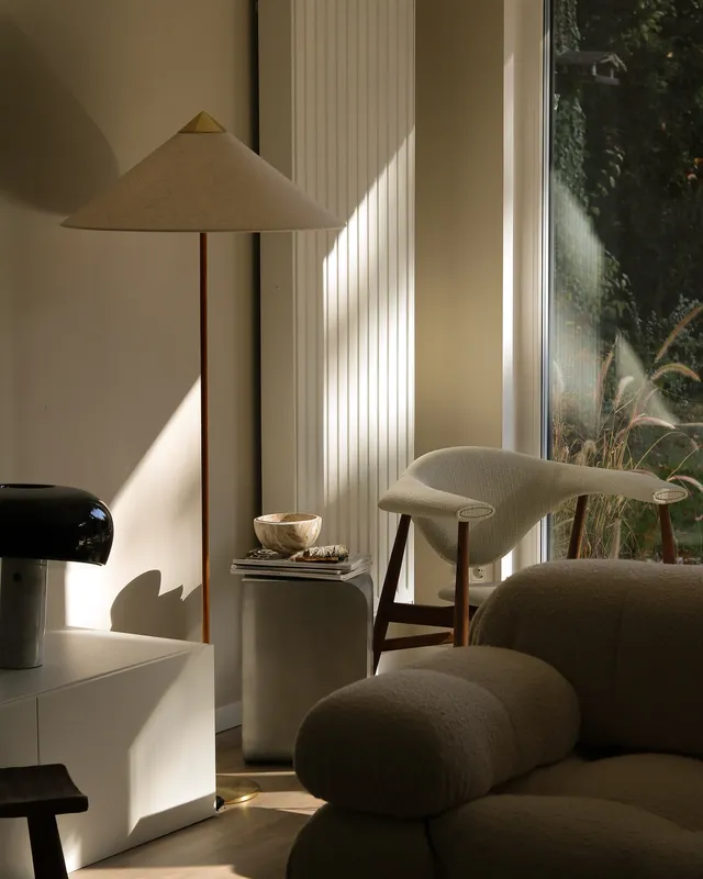 Layered angular wooden panels with warm accent lighting.