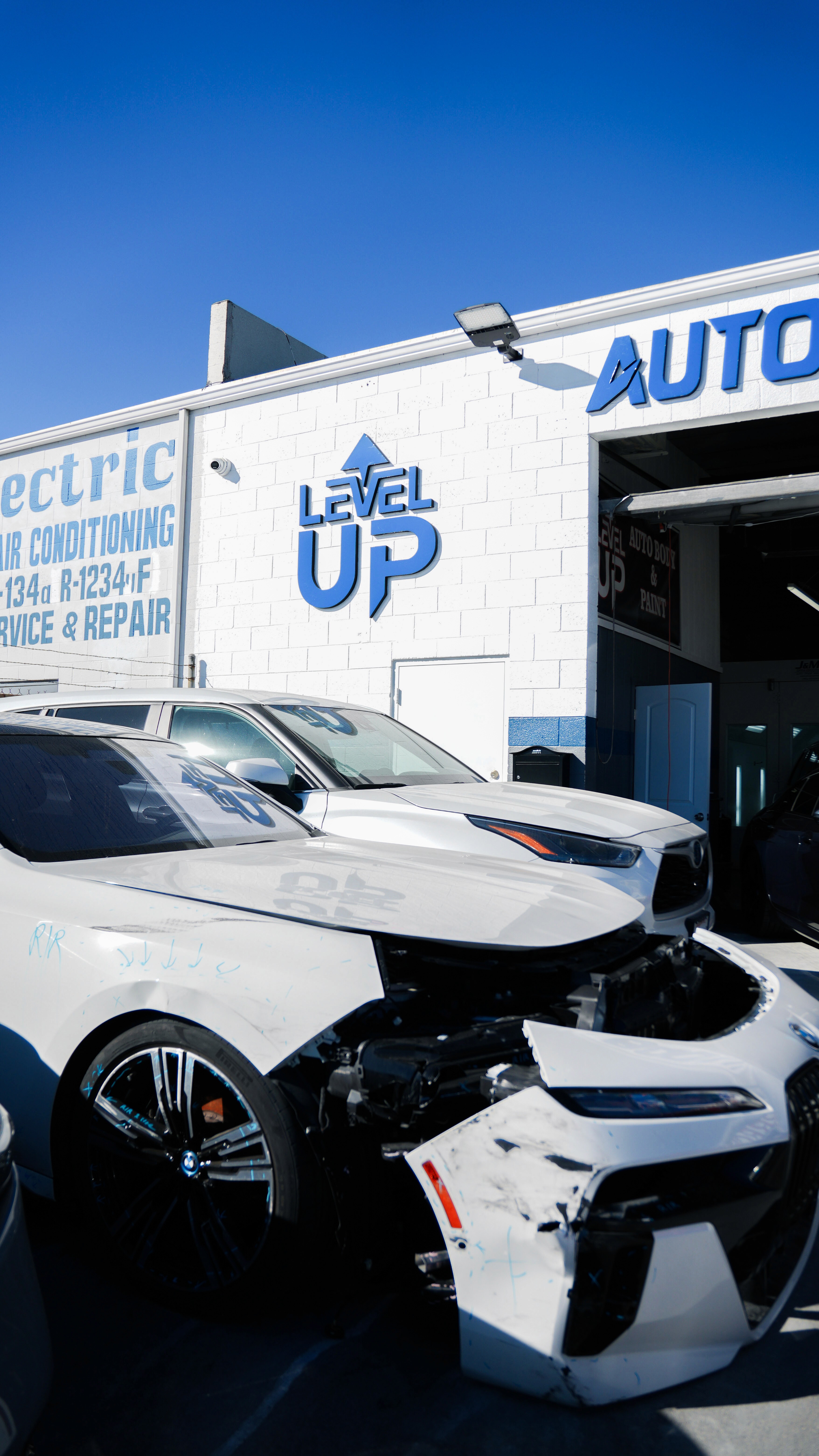 Gandfather and grandson talking about an engine