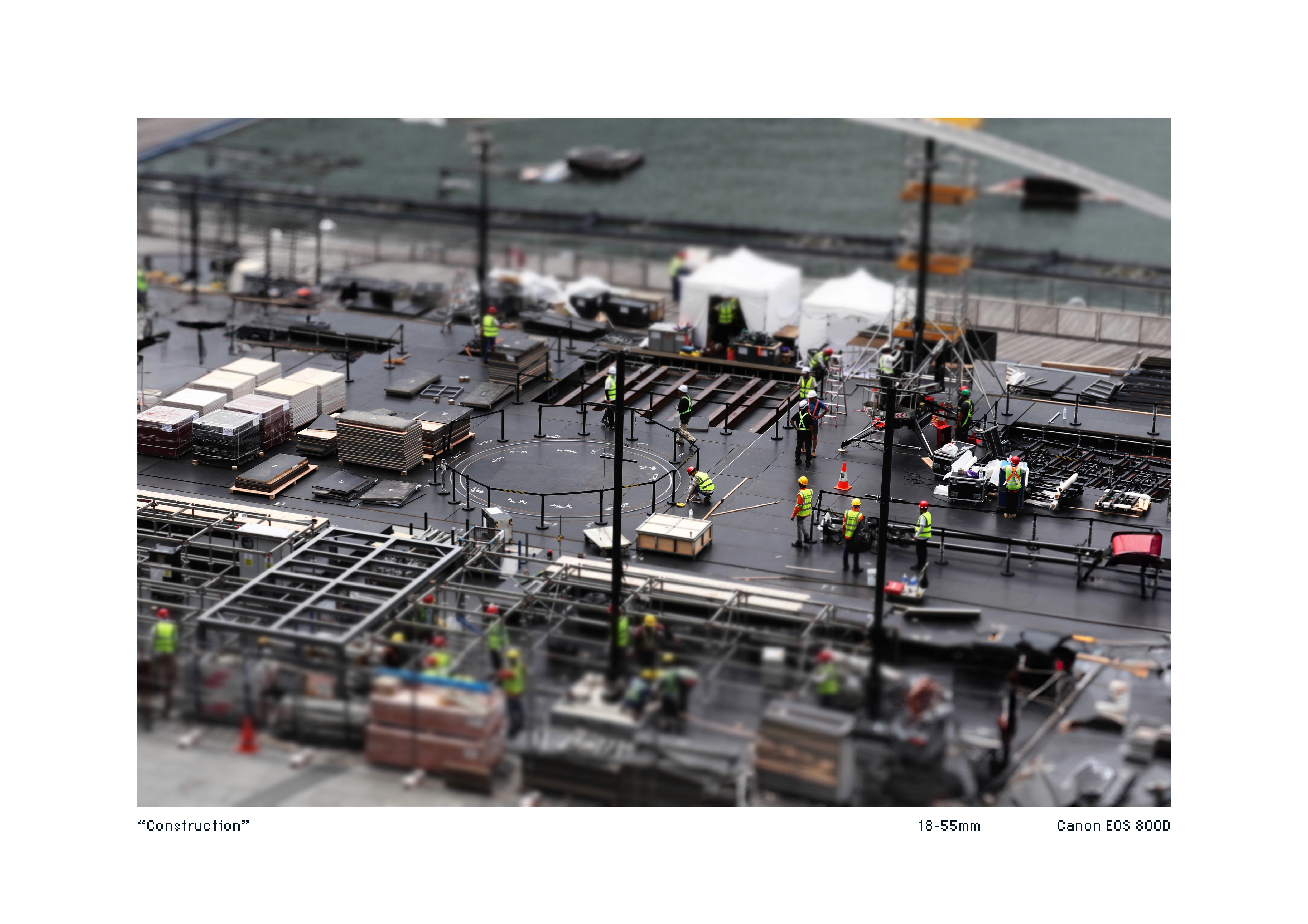 Tiltshift image of workers building a structure