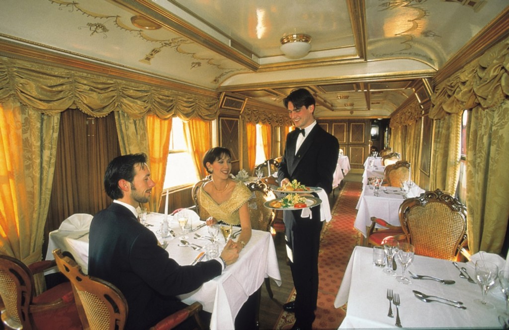 an aerial view of a baseball stadium with a city in the background