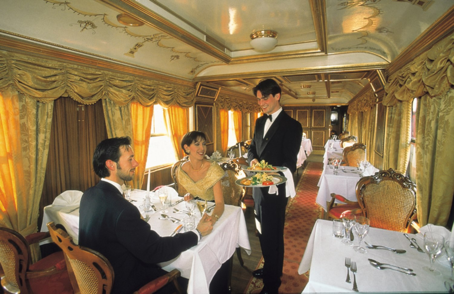 an aerial view of a baseball stadium with a city in the background
