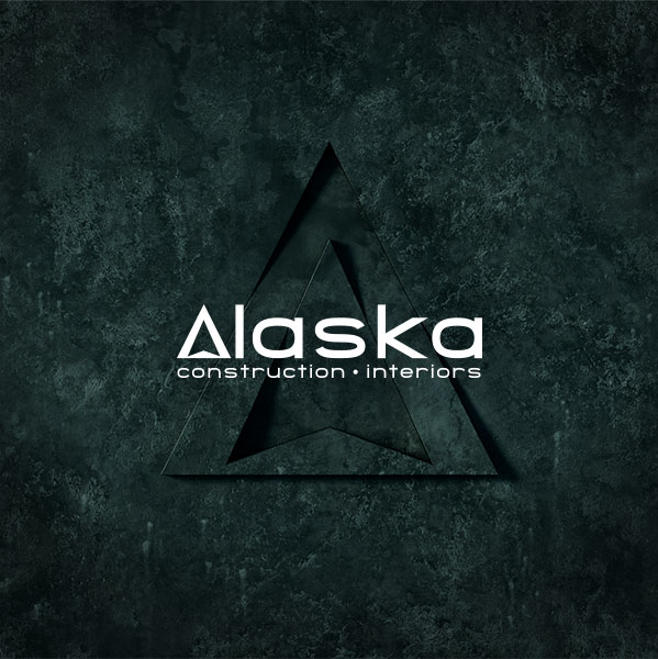 Alaska logomark on deep green stone texture