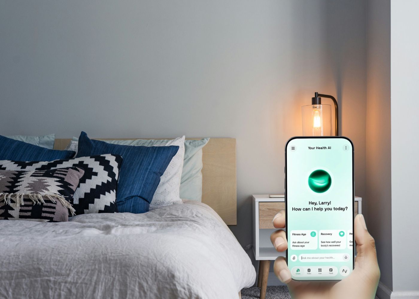 Bed beside a phone showing the Neura AI sleep coach app