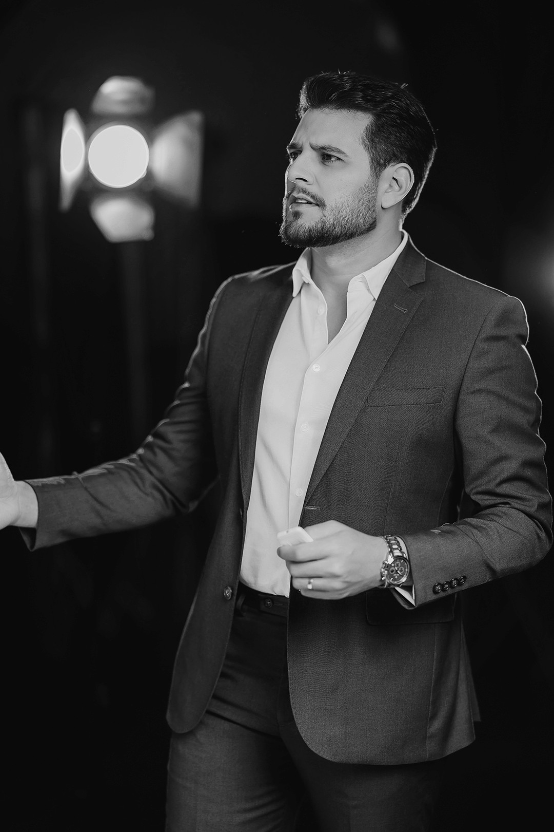 Black and white photo of man posing on camera