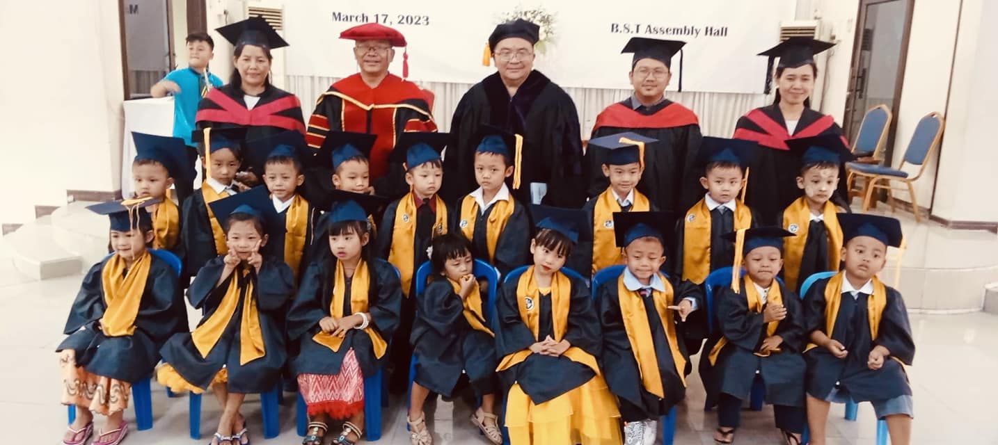 Faculty of Elpis International School gathered in front of the school campus in Yangon, Myanmar