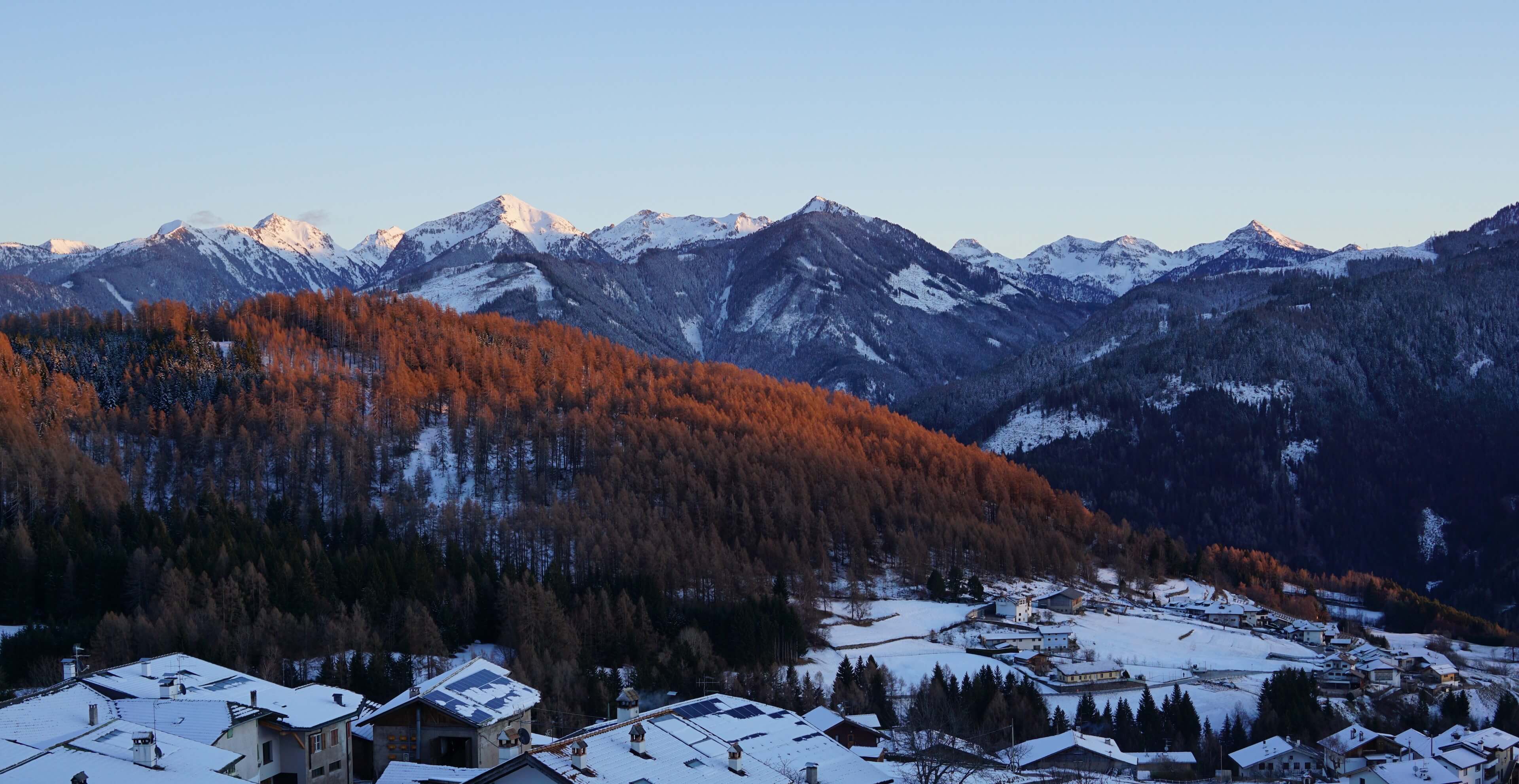 Panoramic view from the balcony over the snowy mountains