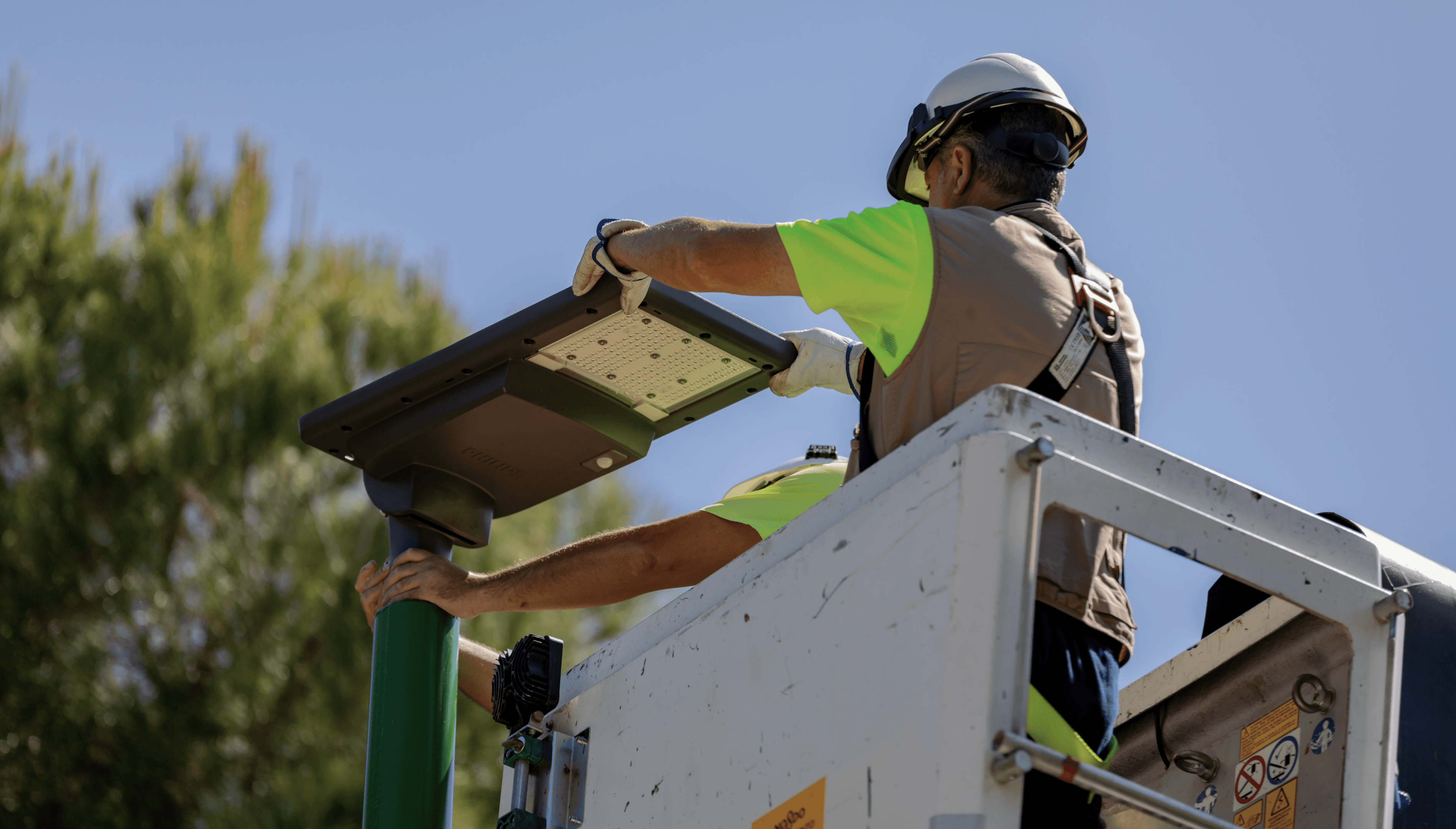 Photo of a technician installing a streetlight