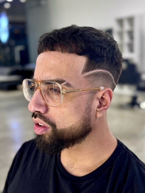 Eyebrow part design while male west hollywood barber luxury The Rich Barber Hair Studio Creative Fade Courtney Palmore