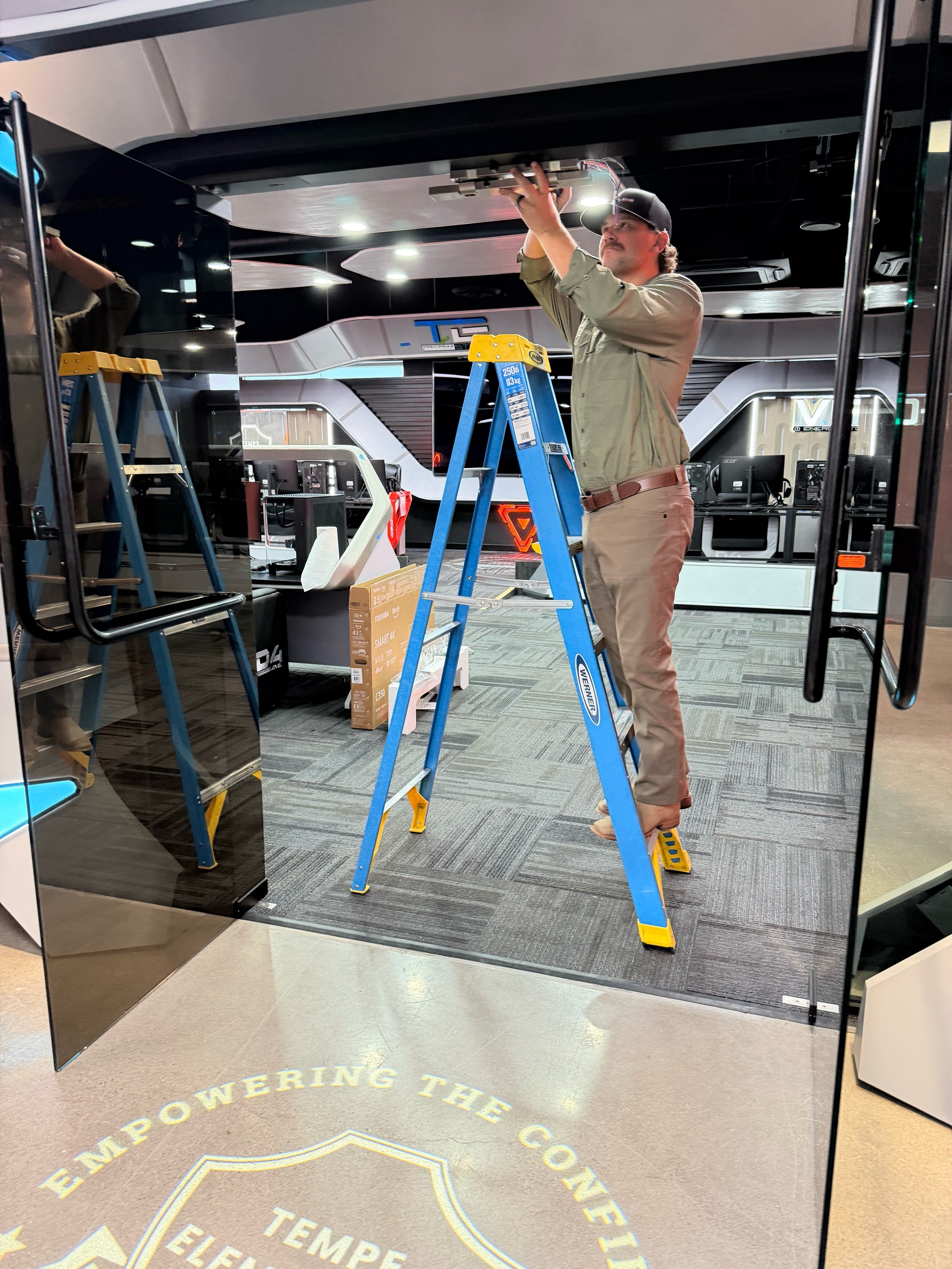 Oculens technician installing a door