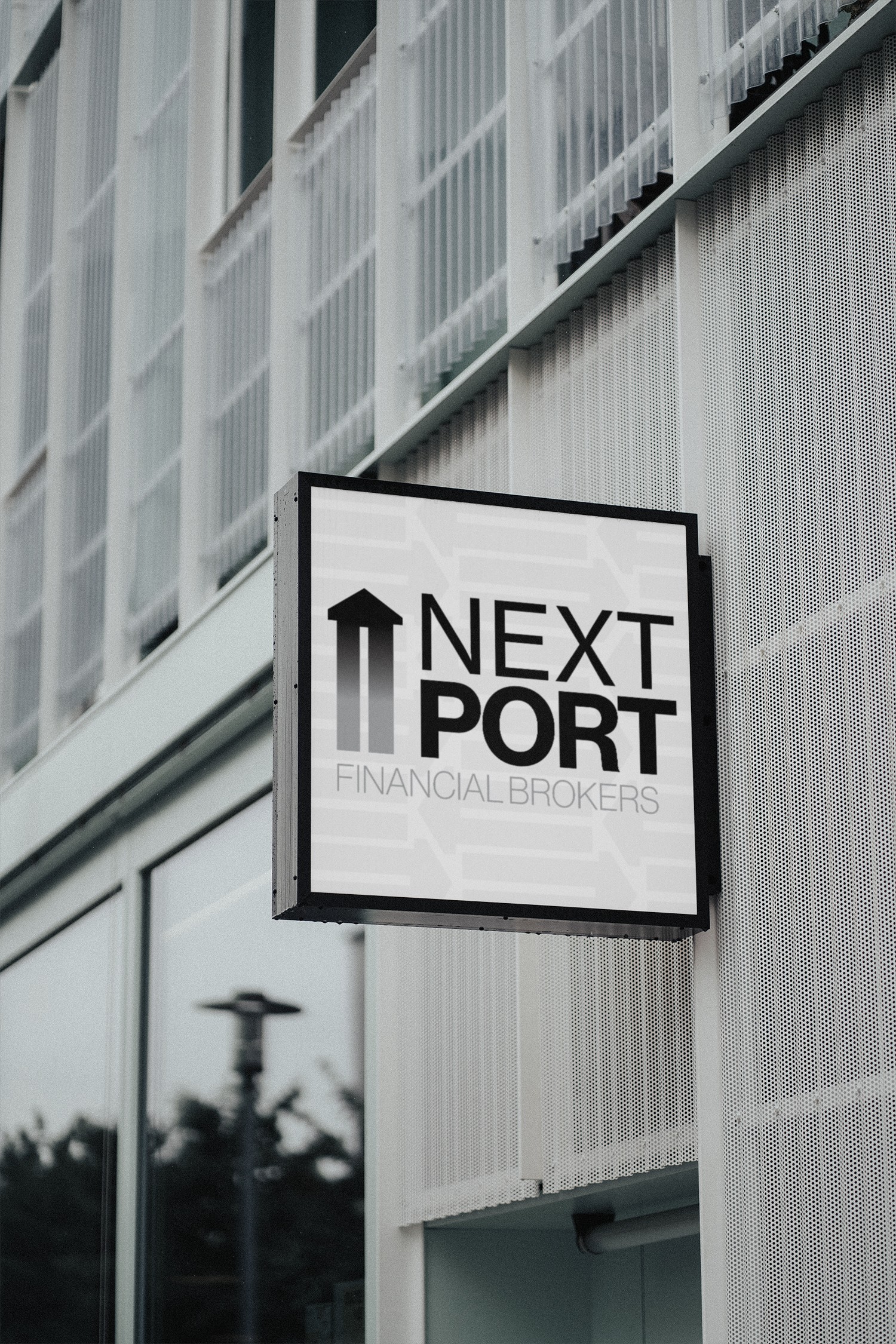 nextport sign hanging off of banking building