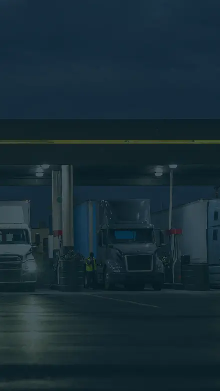 Parked semi-trucks at a gas station