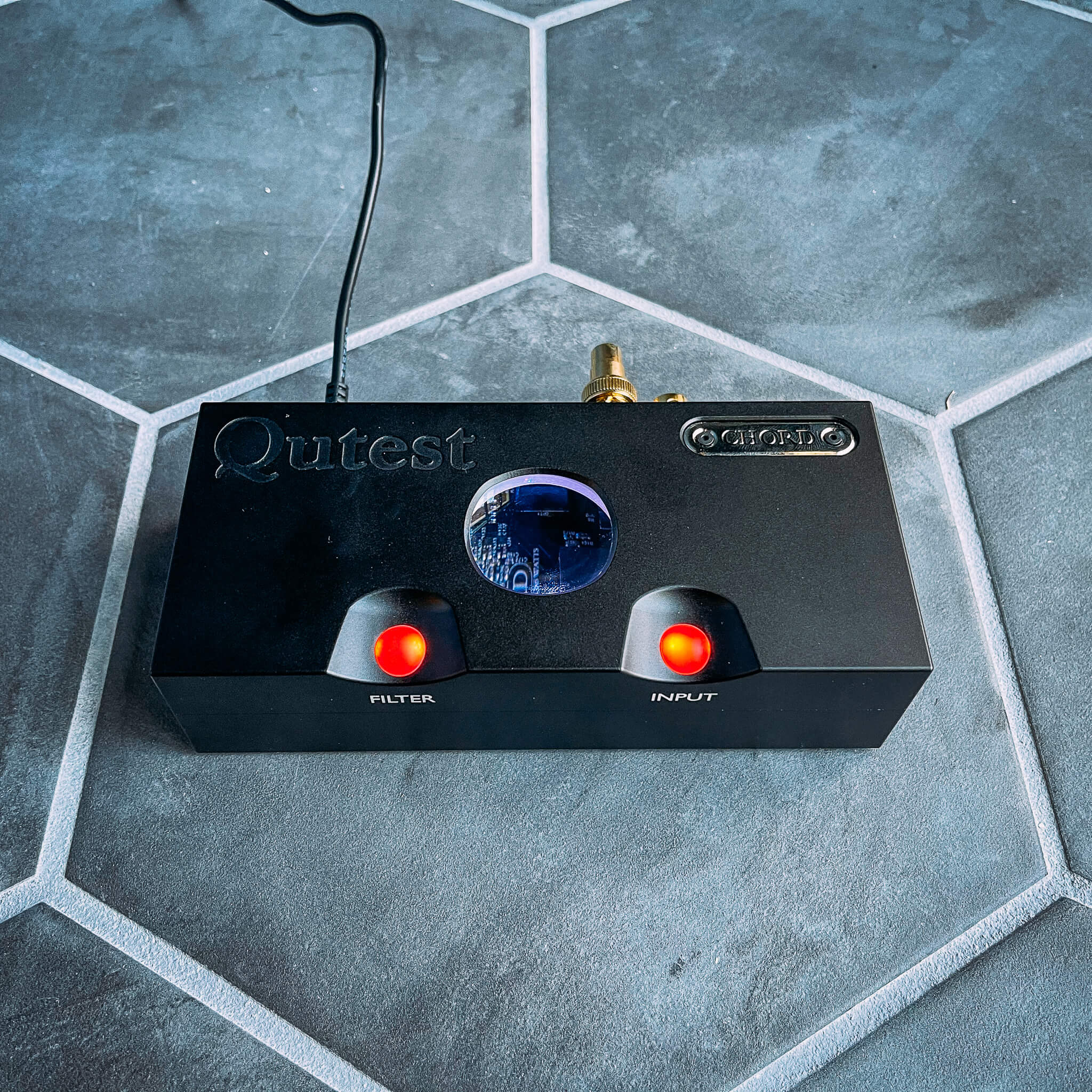 Shot of Chord Qutest on with colored pebble lights and portal in top