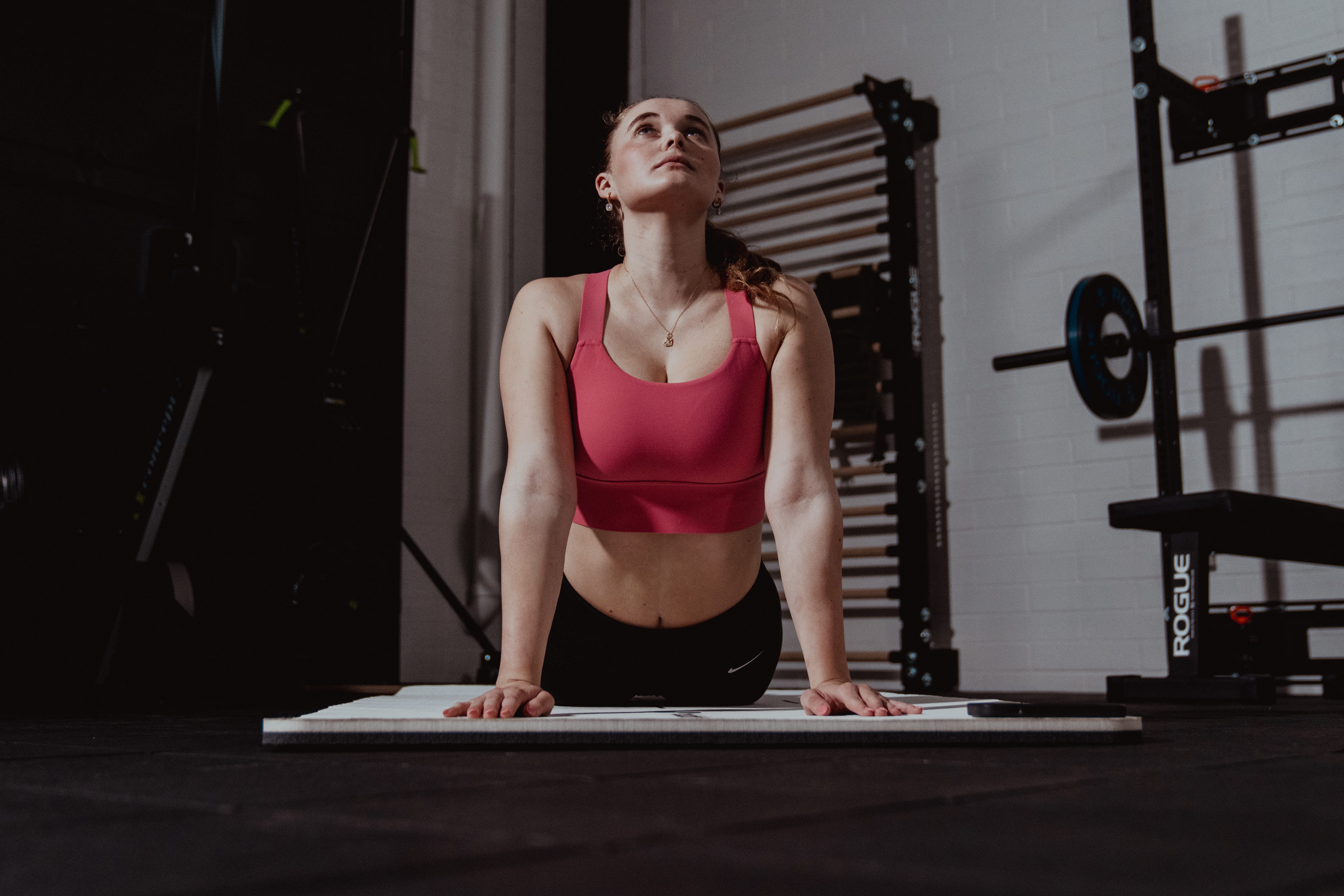 person in yoga pose - What Causes Neck Stiffness