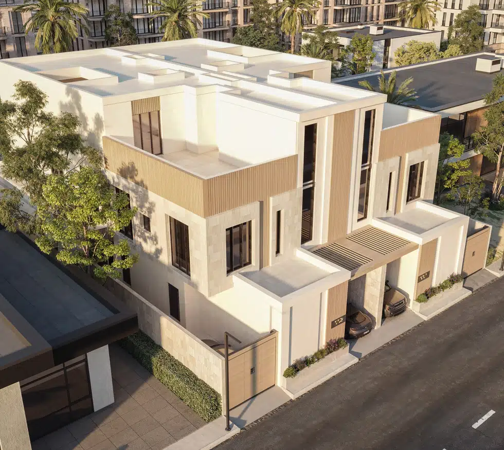 منظور جوي لتوأم فيلا حديثة يوضح الكتل المعمارية والأسطح والمداخل ومواقف السيارات الأمامية.