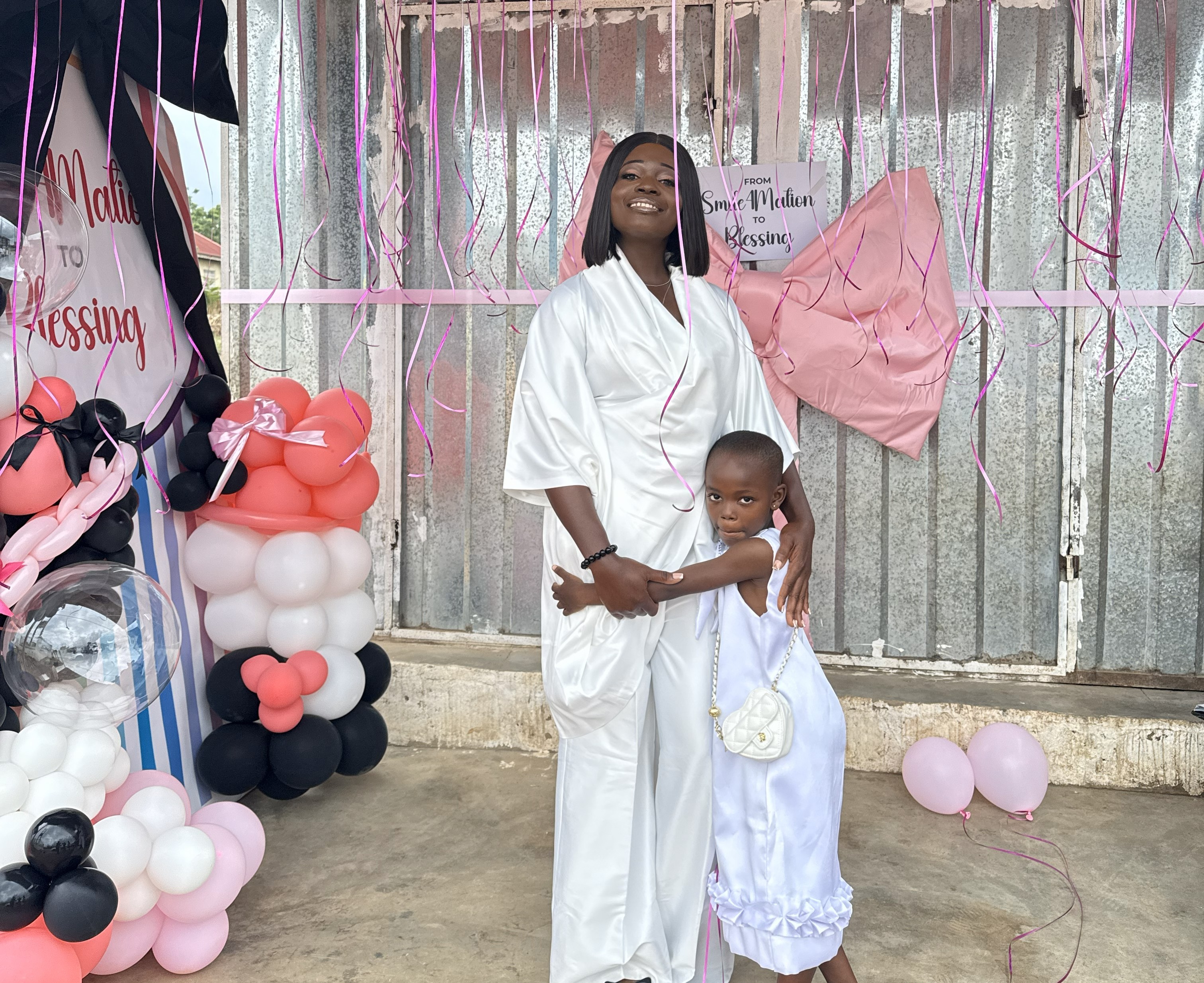 a couple of people standing next to a motorcycle