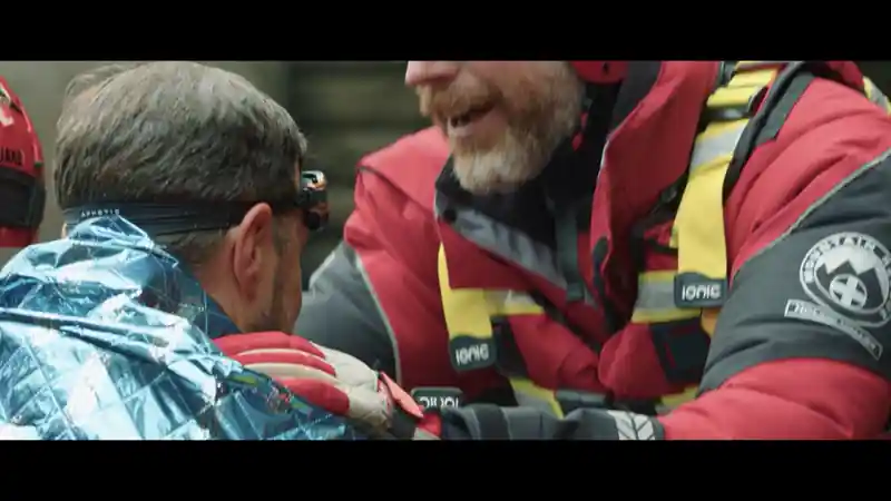 Group of presenters speaking on camera during a Microsoft live broadcast, filmed against branded event graphics.