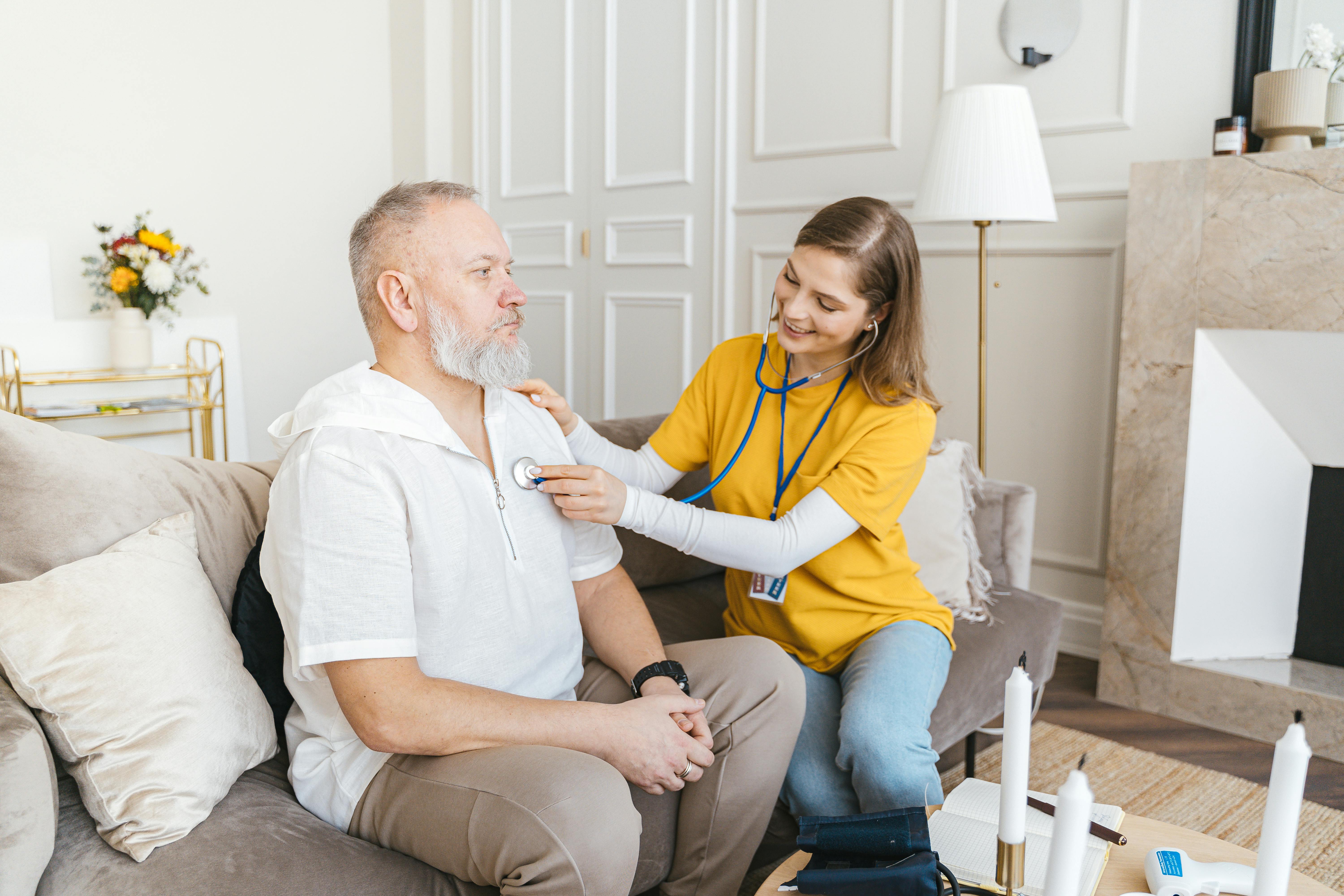 a-nurse-uses-a-stethoscope-for-a-home-check-up-on-a-senior-adult-in-a-cozy-livin - antoni-shkraba-studio (pexels)