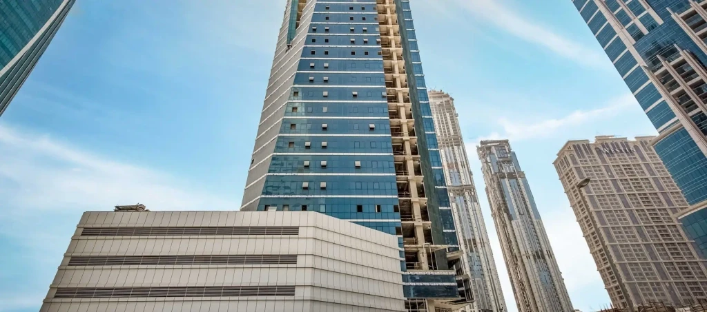 Modern office tower in Business Bay showcased by a real estate agent for prime commercial listings.