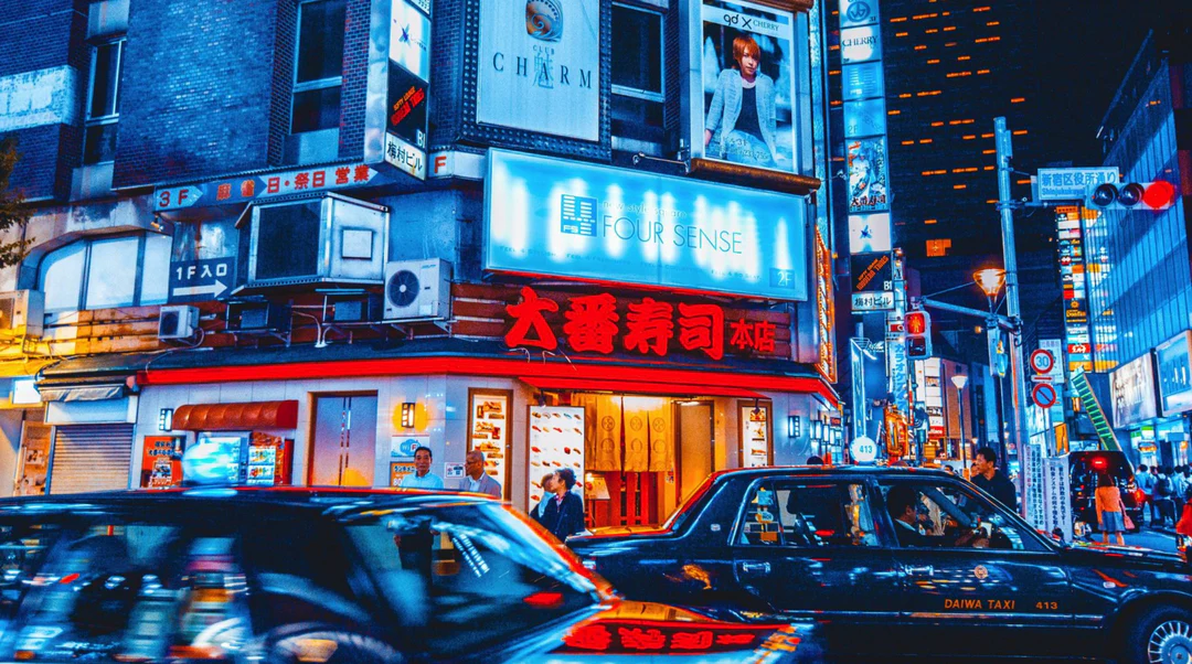 a street with cars and signs on it